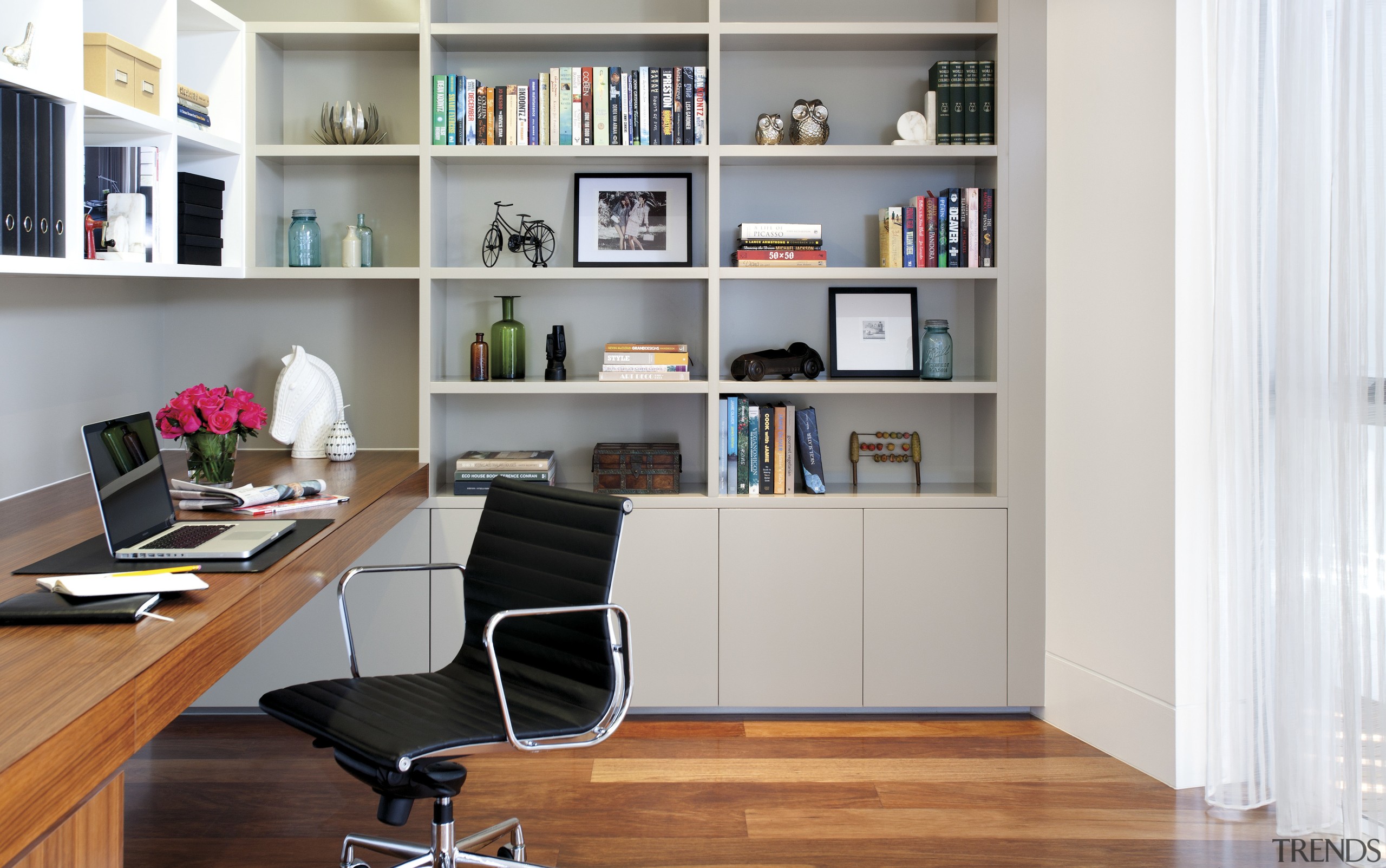 View of study area with wooden flooring and bookcase, desk, floor, furniture, home, interior design, living room, office, shelf, shelving, white