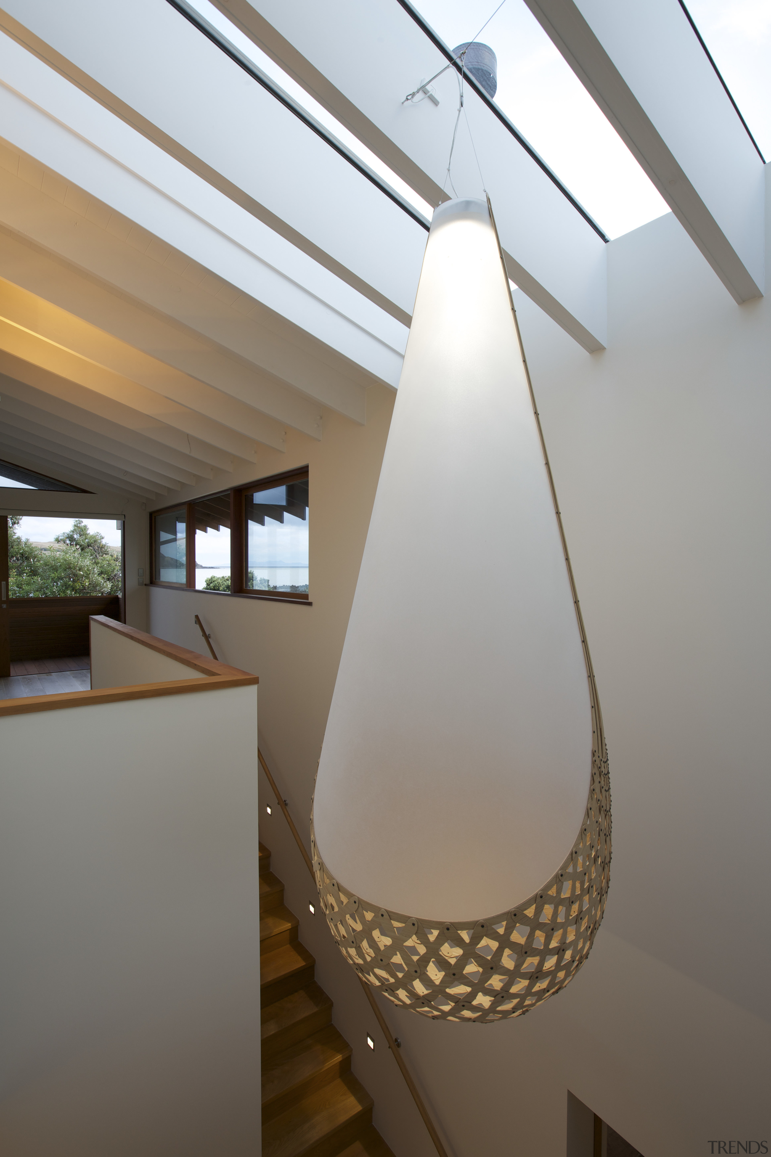 A sculptural light fitting provides a playful visual architecture, ceiling, daylighting, interior design, light fixture, lighting, product design, gray, white