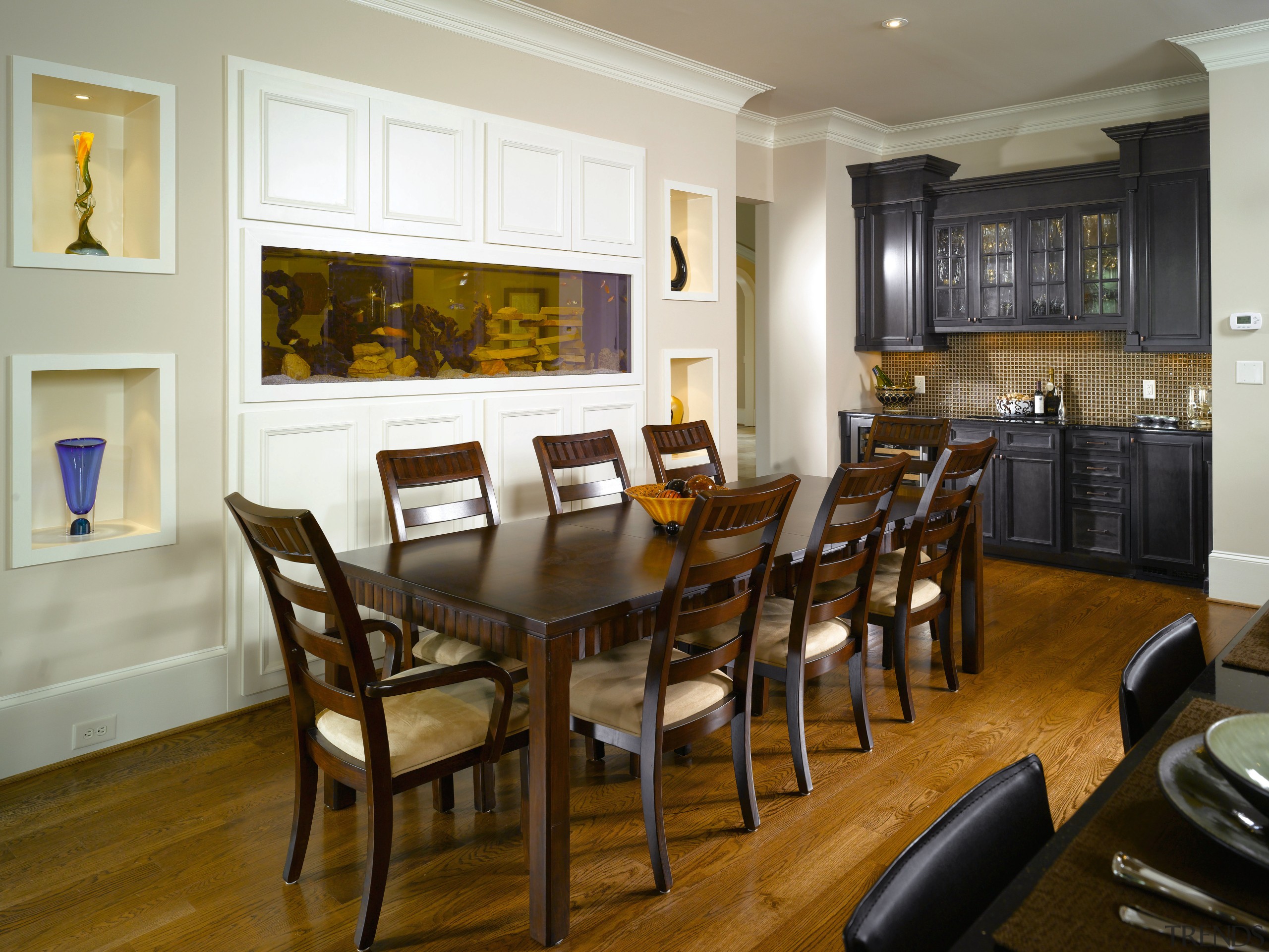 The wet bar connects to the main kitchen dining room, furniture, interior design, living room, room, table, brown, gray