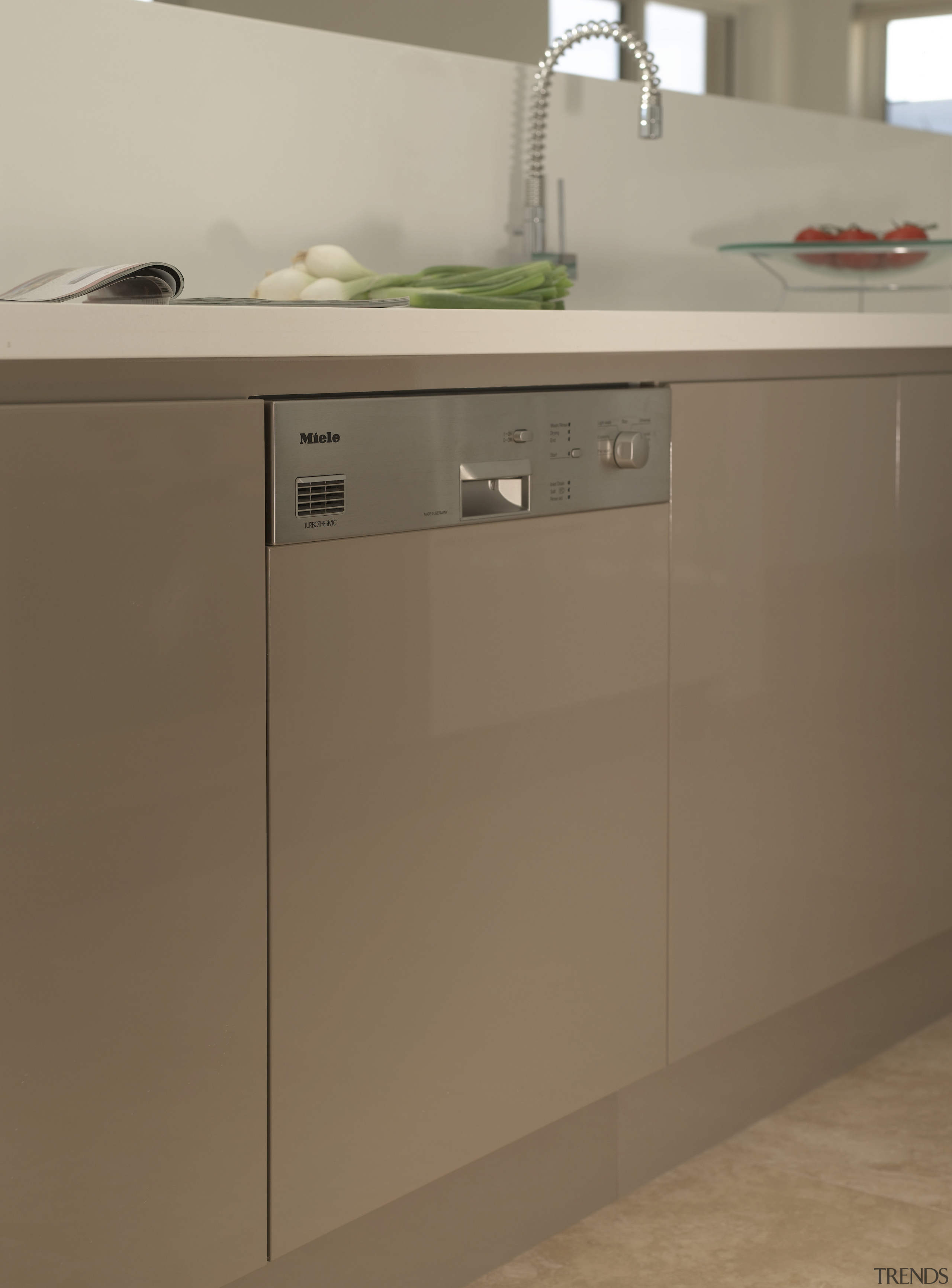 The Miele G975 i intergrated dishwasher can accommodate bathroom accessory, bathroom cabinet, cabinetry, chest of drawers, countertop, drawer, furniture, home appliance, kitchen, kitchen appliance, major appliance, product, product design, sideboard, sink, brown, gray