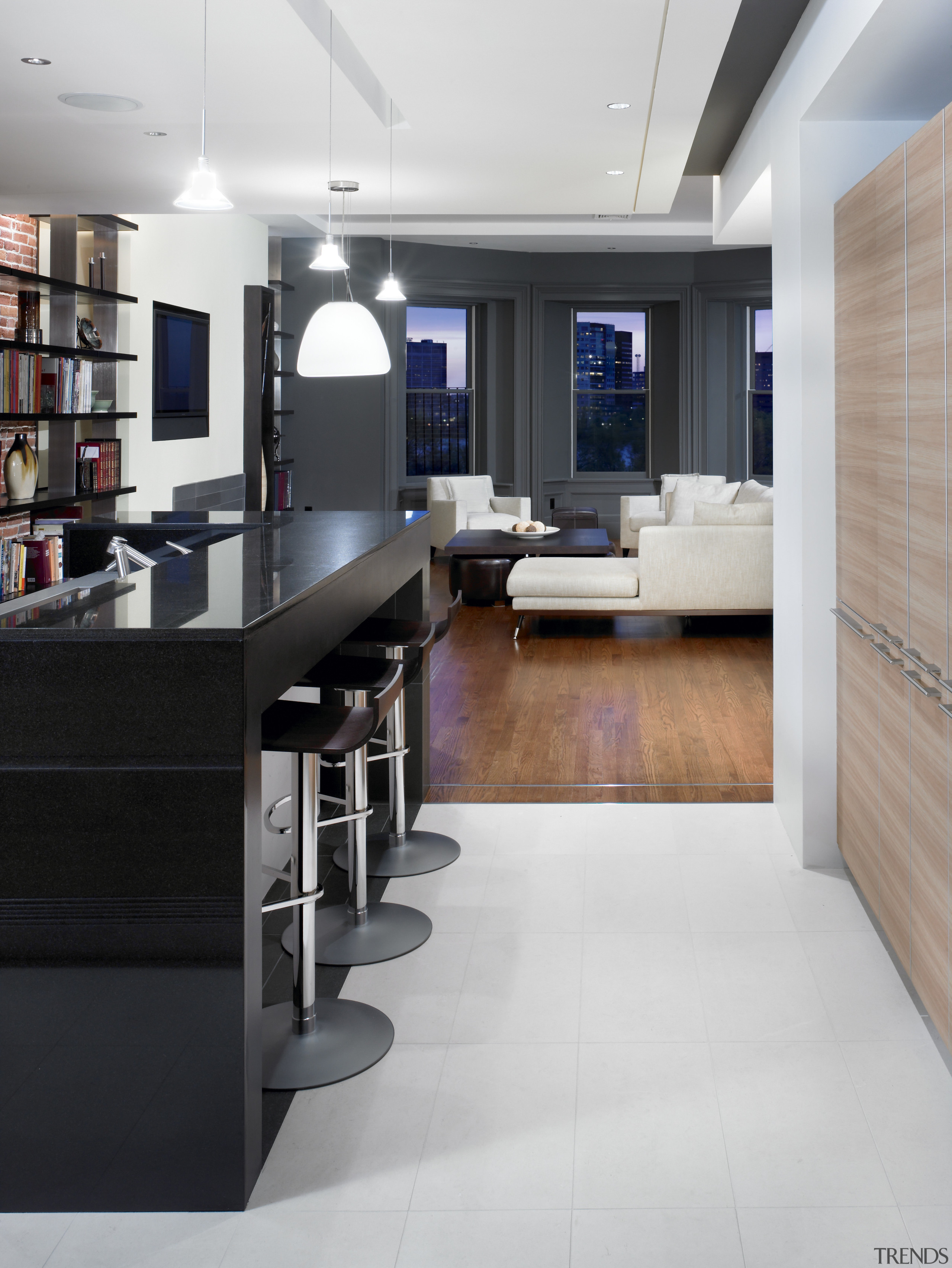 View of a renovated kitchen which features a floor, flooring, furniture, interior design, kitchen, office, wood flooring, gray, black