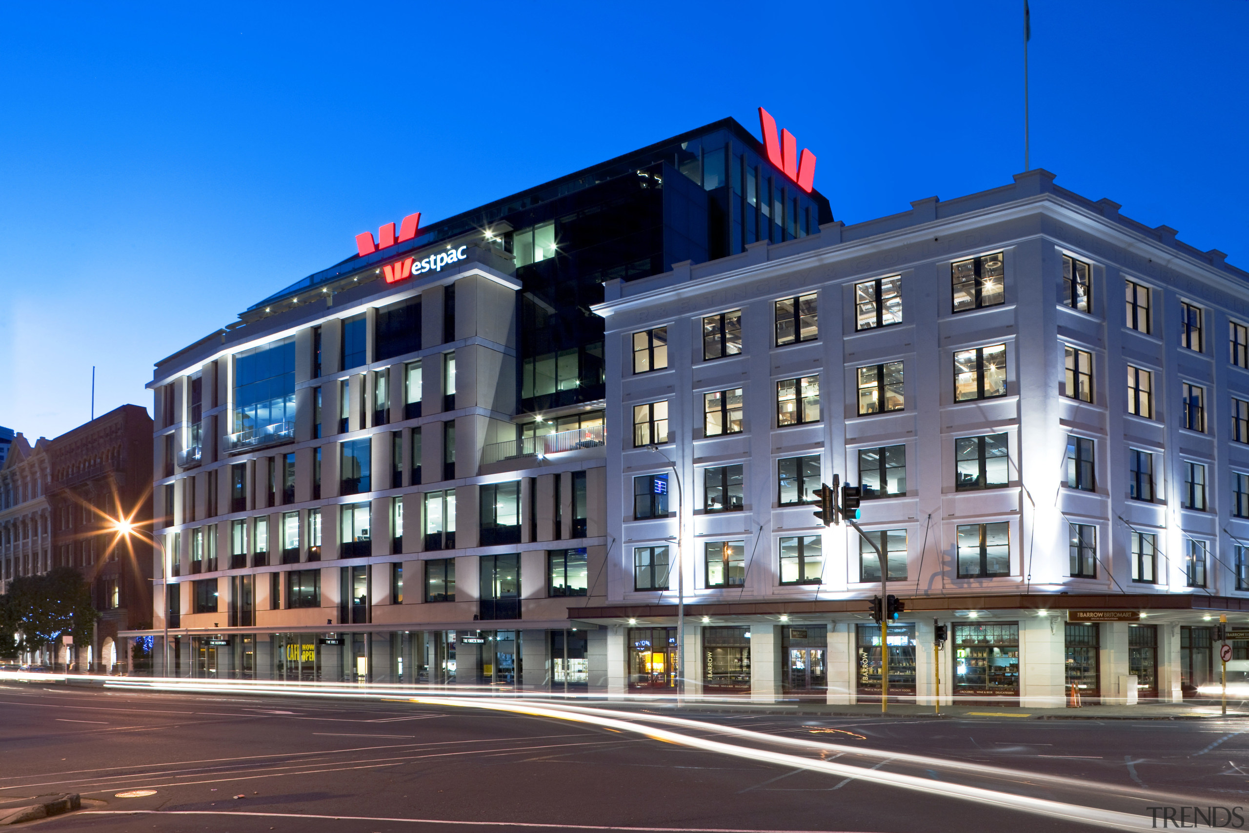 Exterior view of the Westpac head office in apartment, architecture, building, city, commercial building, condominium, corporate headquarters, downtown, evening, facade, headquarters, home, hotel, house, landmark, metropolis, metropolitan area, mixed use, neighbourhood, night, plaza, real estate, residential area, sky, street, town, urban area, window, blue