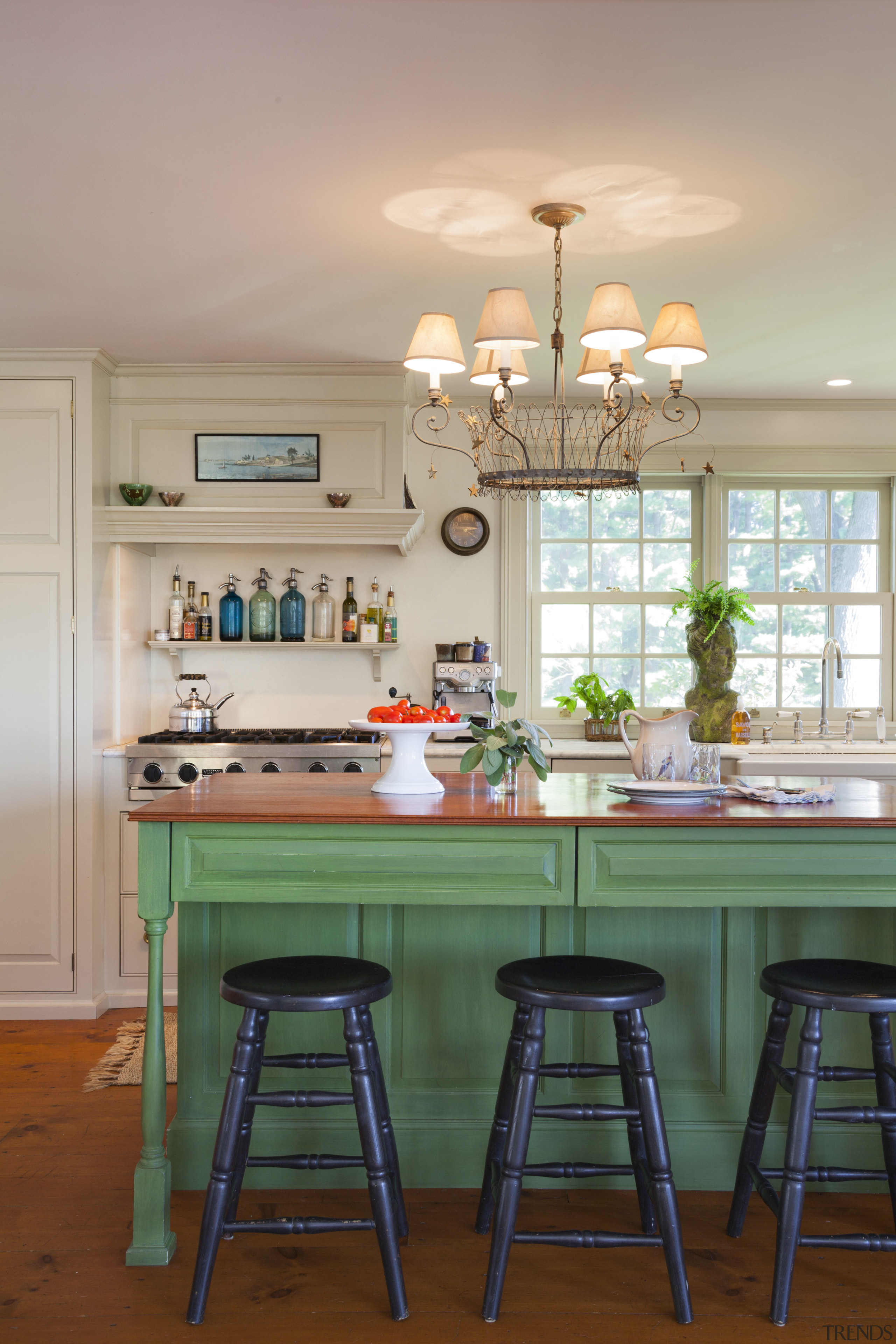 This kitchen blends with its surroundings through architectural countertop, dining room, furniture, home, house, interior design, kitchen, room, table, gray