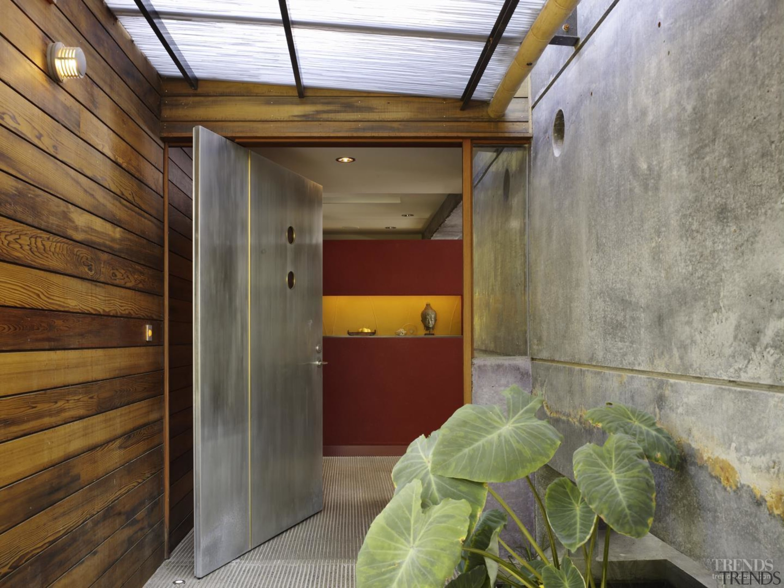 A zinc and brass pivot door makes a architecture, house, real estate, gray, brown