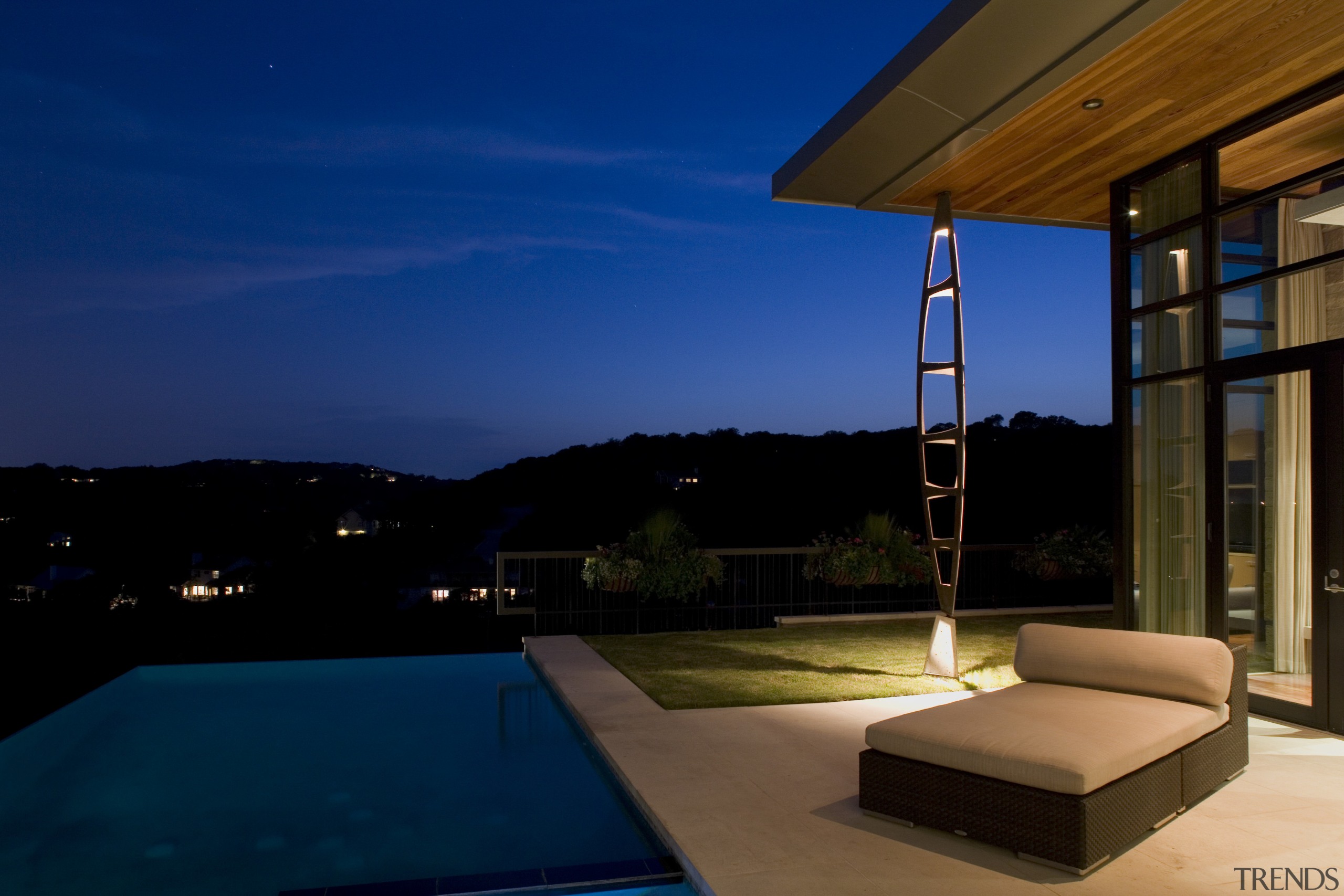 Exterior of contemporary home features unique design &amp; architecture, estate, home, house, interior design, lighting, property, real estate, sky, swimming pool, window, blue