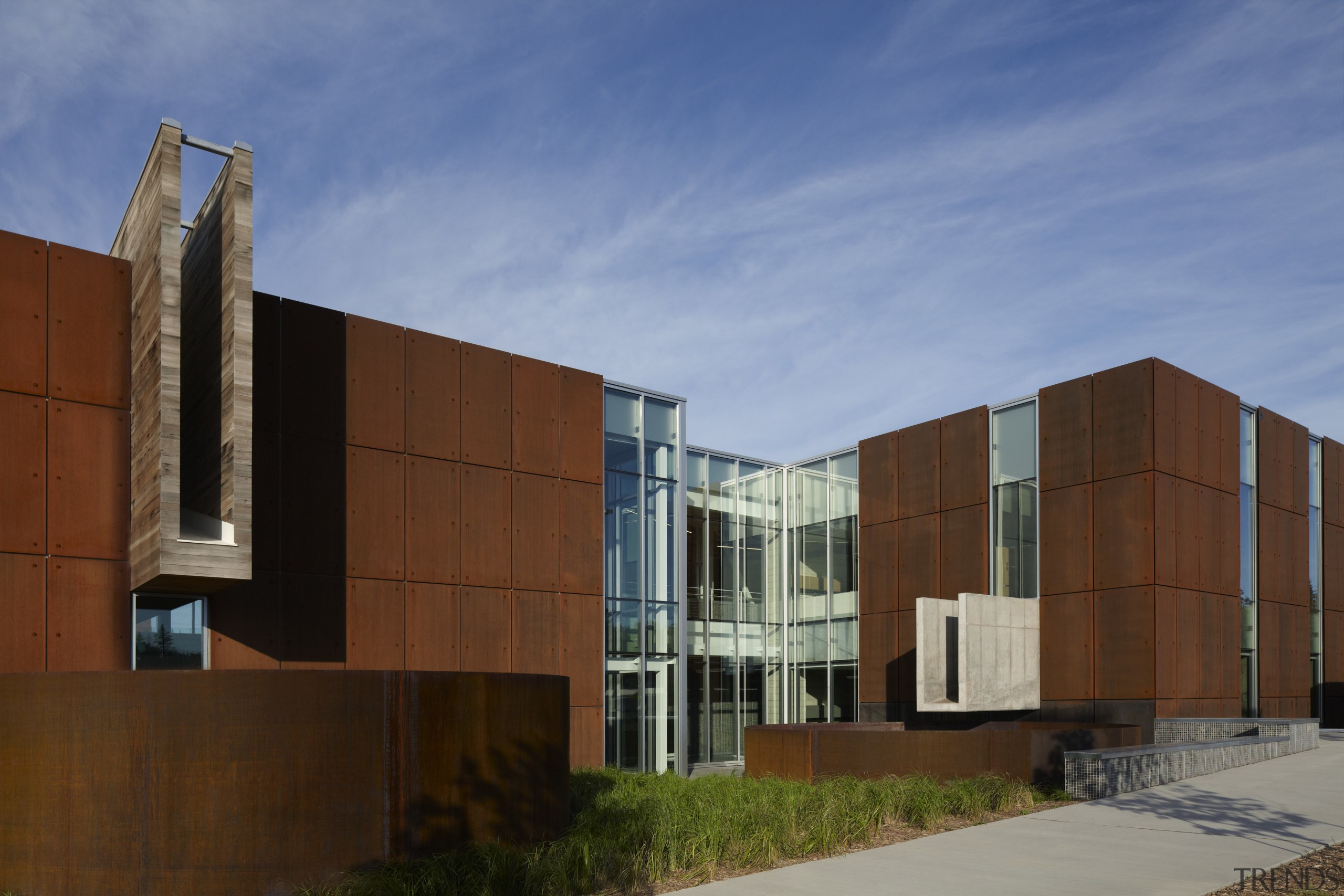 Here is an exterior view of the University apartment, architecture, building, corporate headquarters, facade, home, house, real estate, residential area, sky, brown, teal