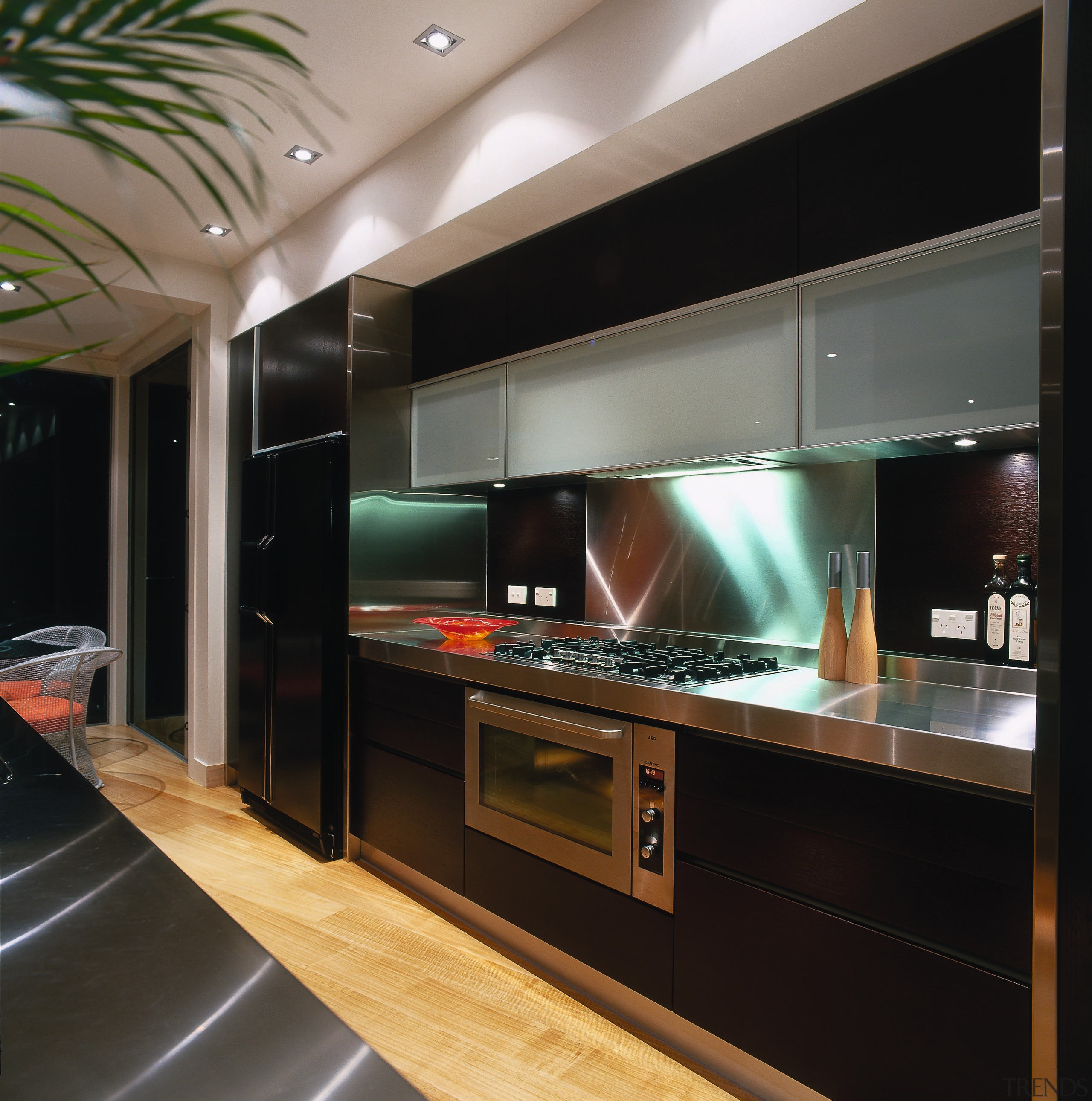 The detail of the cooking area of a cabinetry, countertop, interior design, kitchen, black