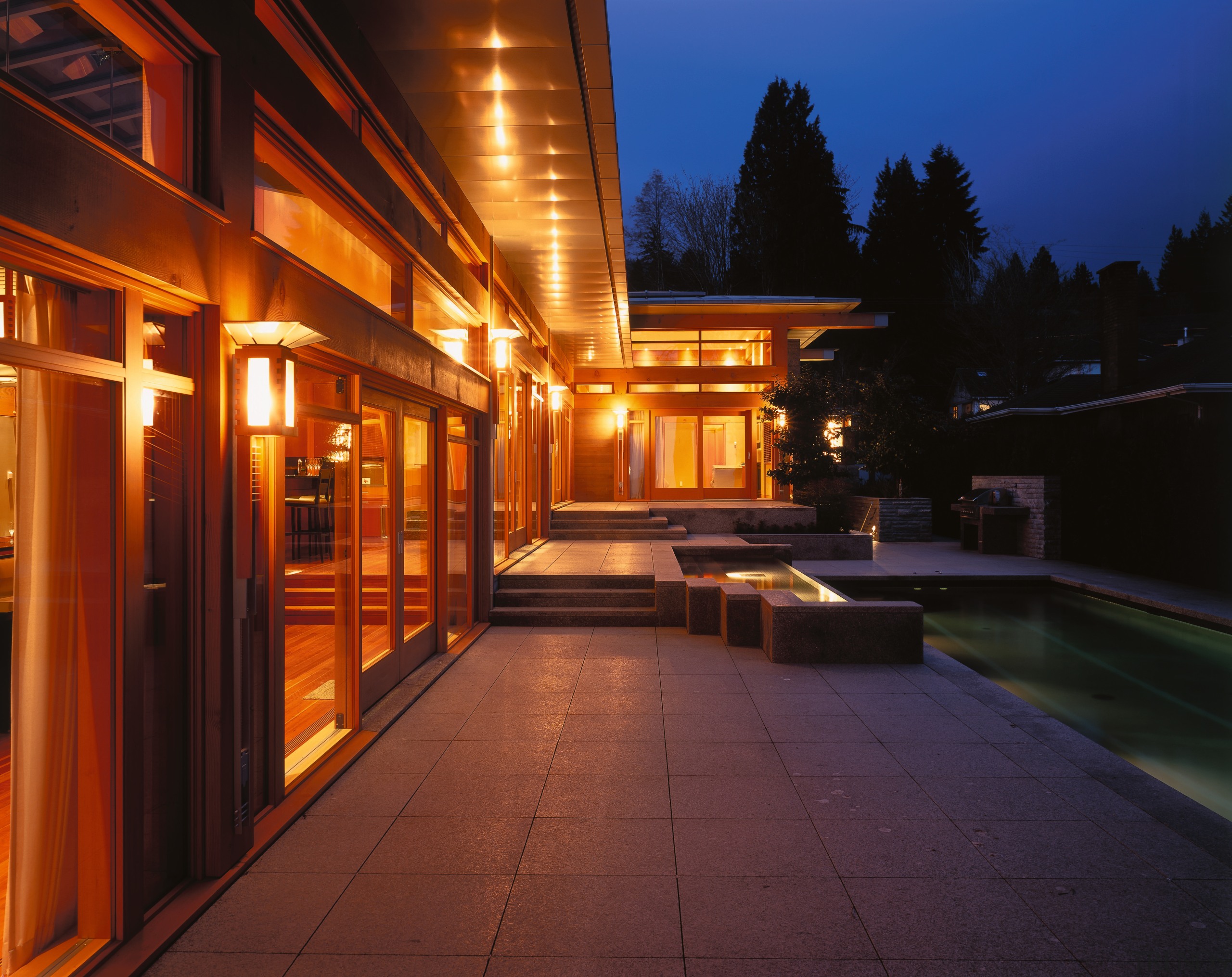 view of the outdoor area showing the doors architecture, estate, evening, facade, home, house, landscape lighting, light, lighting, night, real estate, residential area, sky, black, red