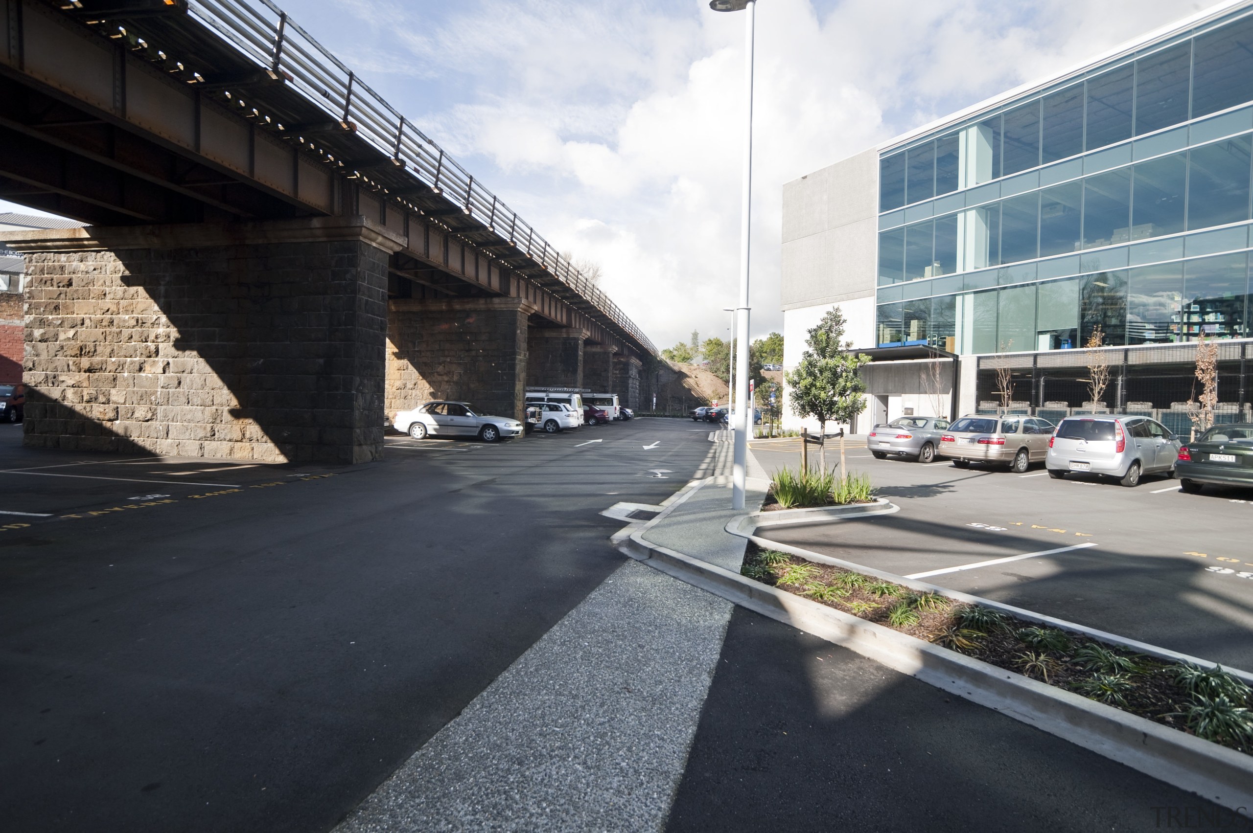 Exterior view of the carpark area - Exterior architecture, asphalt, building, car, controlled access highway, fixed link, highway, infrastructure, lane, metropolitan area, overpass, residential area, road, road surface, sky, skyway, street, transport, urban area, vehicle, black