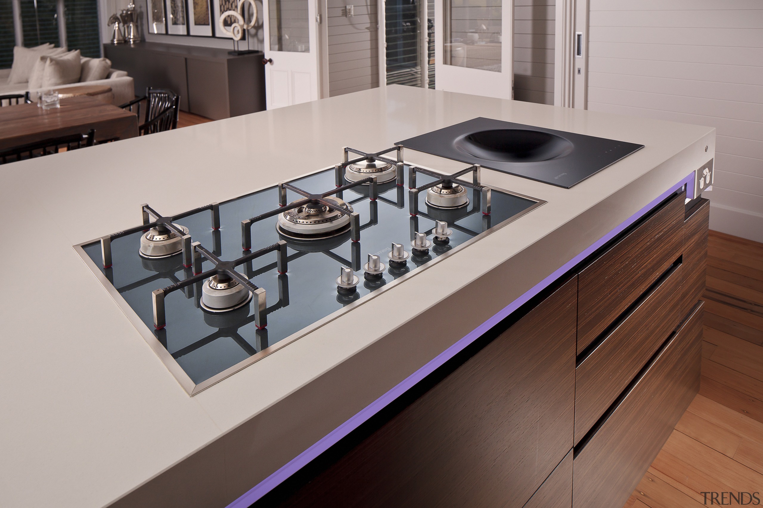 Contemporary kitchen with cooktop and inbuilt wok. countertop, furniture, kitchen, kitchen stove, product design, sink, gray, red