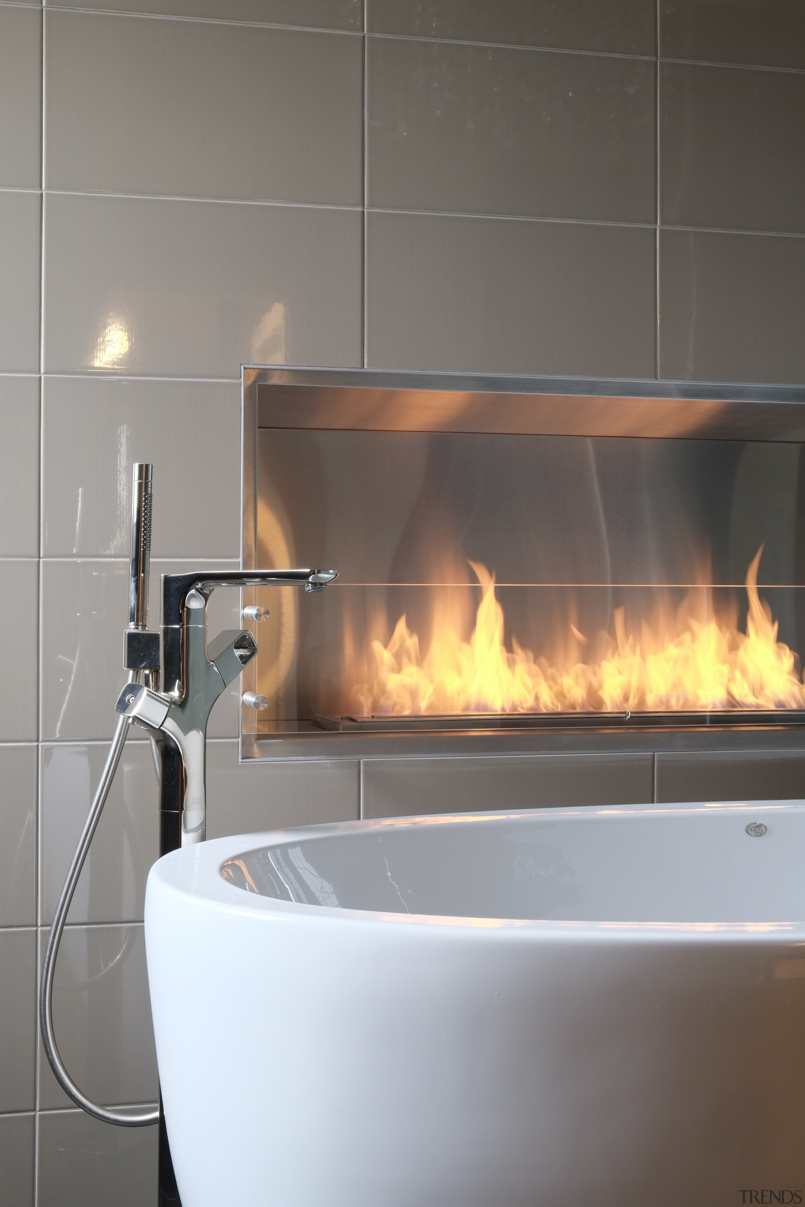 With glittering reflections, dancing flames and smooth textures, fireplace, hearth, plumbing fixture, sink, gray