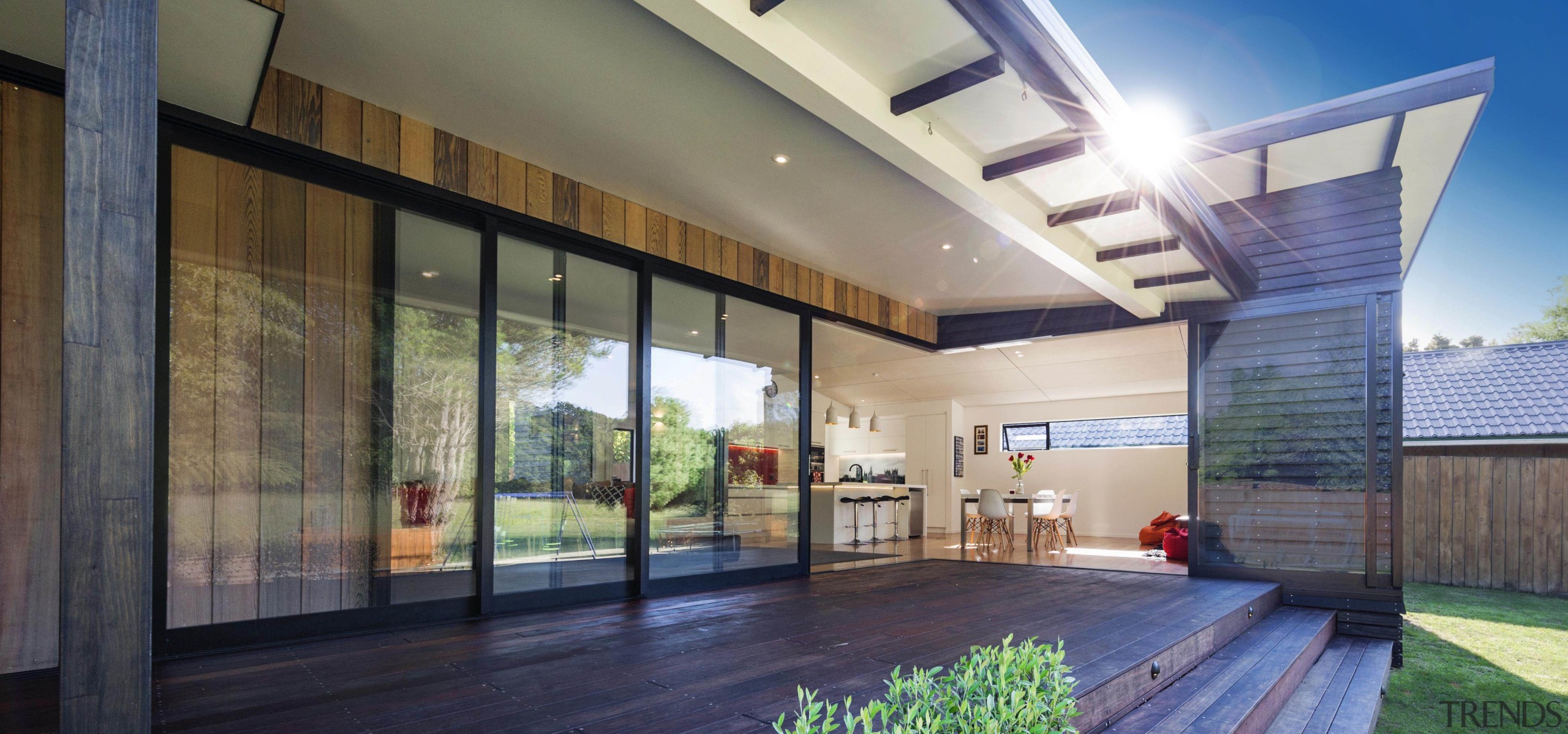 Note the fluid indoor-outdoor flow of home - architecture, condominium, daylighting, estate, facade, home, house, interior design, lobby, property, real estate, window, gray