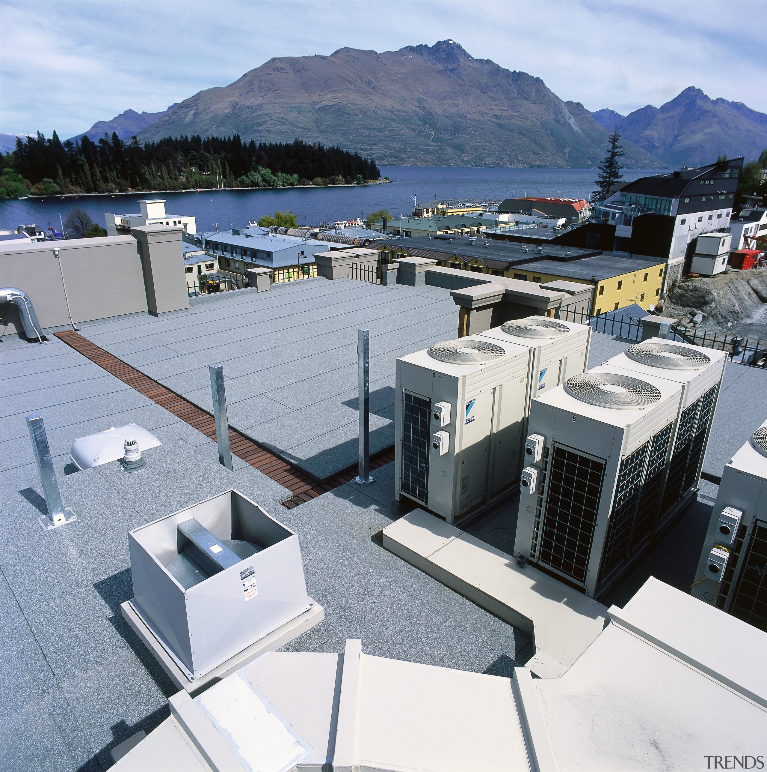 An exterior view of the heating and cooling architecture, roof, water, gray