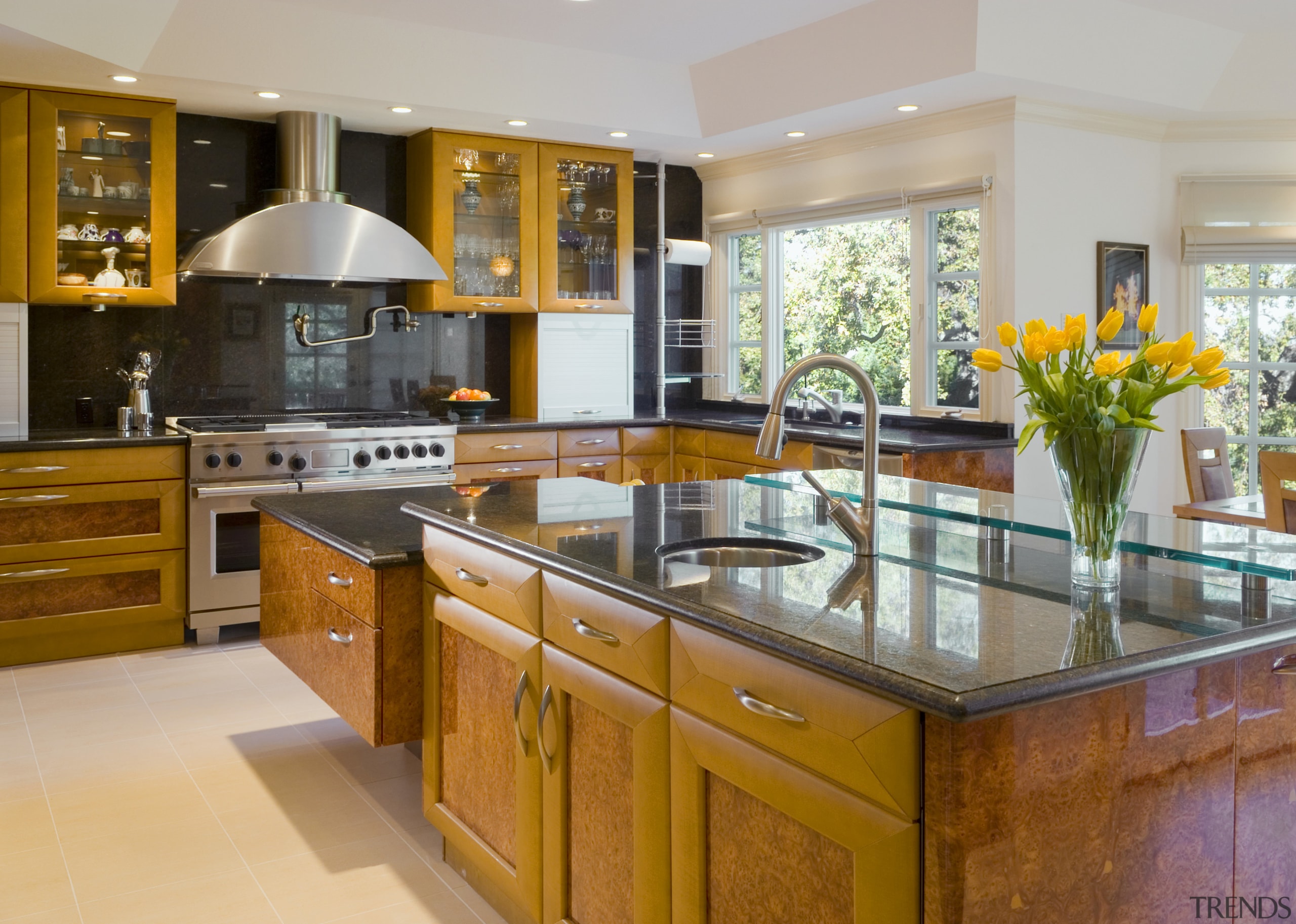 view of kitchen including cabinetry, granite countertops, tile cabinetry, countertop, cuisine classique, estate, interior design, kitchen, real estate, room, gray, brown