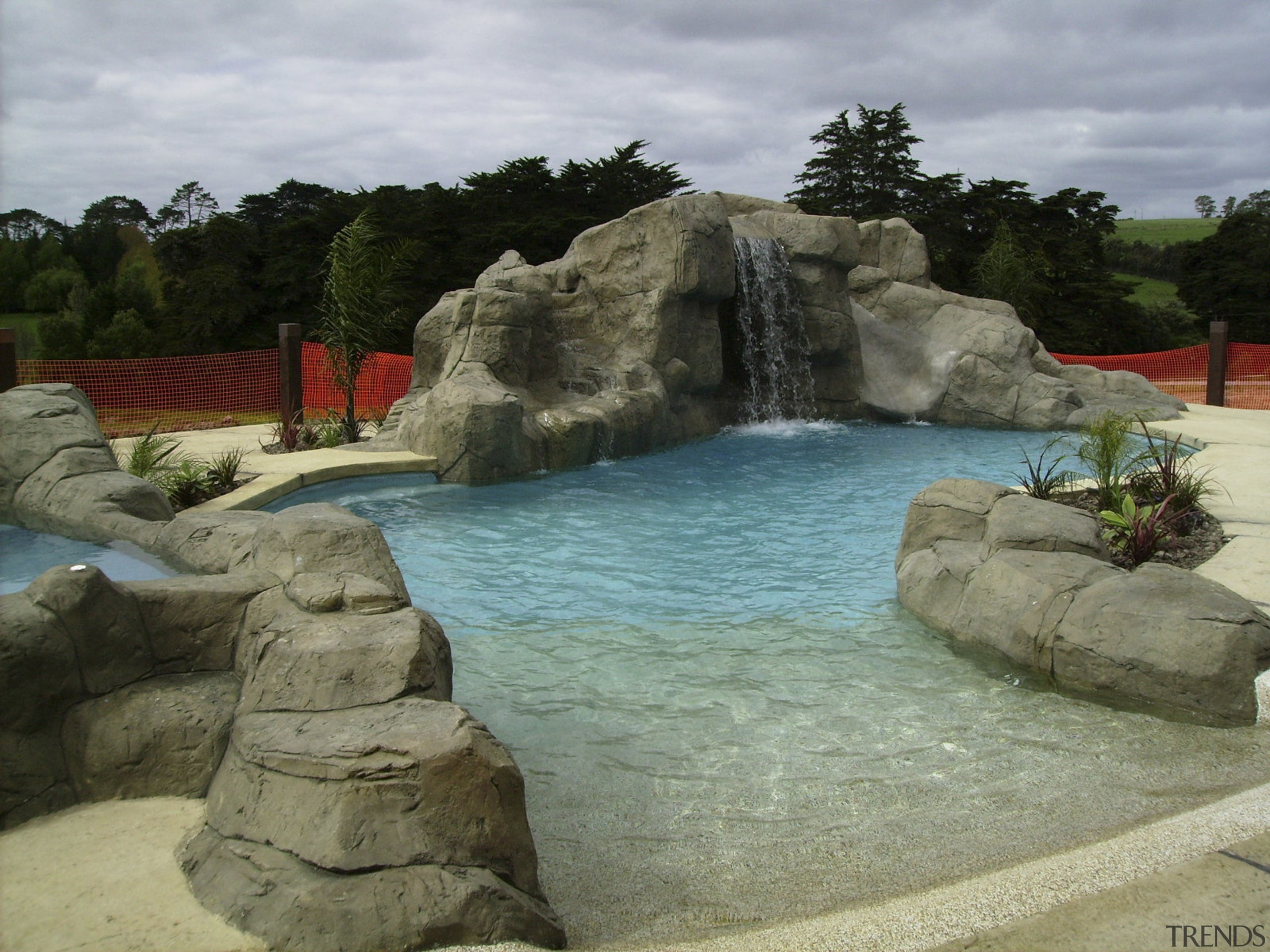 View of the pool area which has a fountain, leisure, swimming pool, water, water feature, water resources, watercourse, waterfall, brown