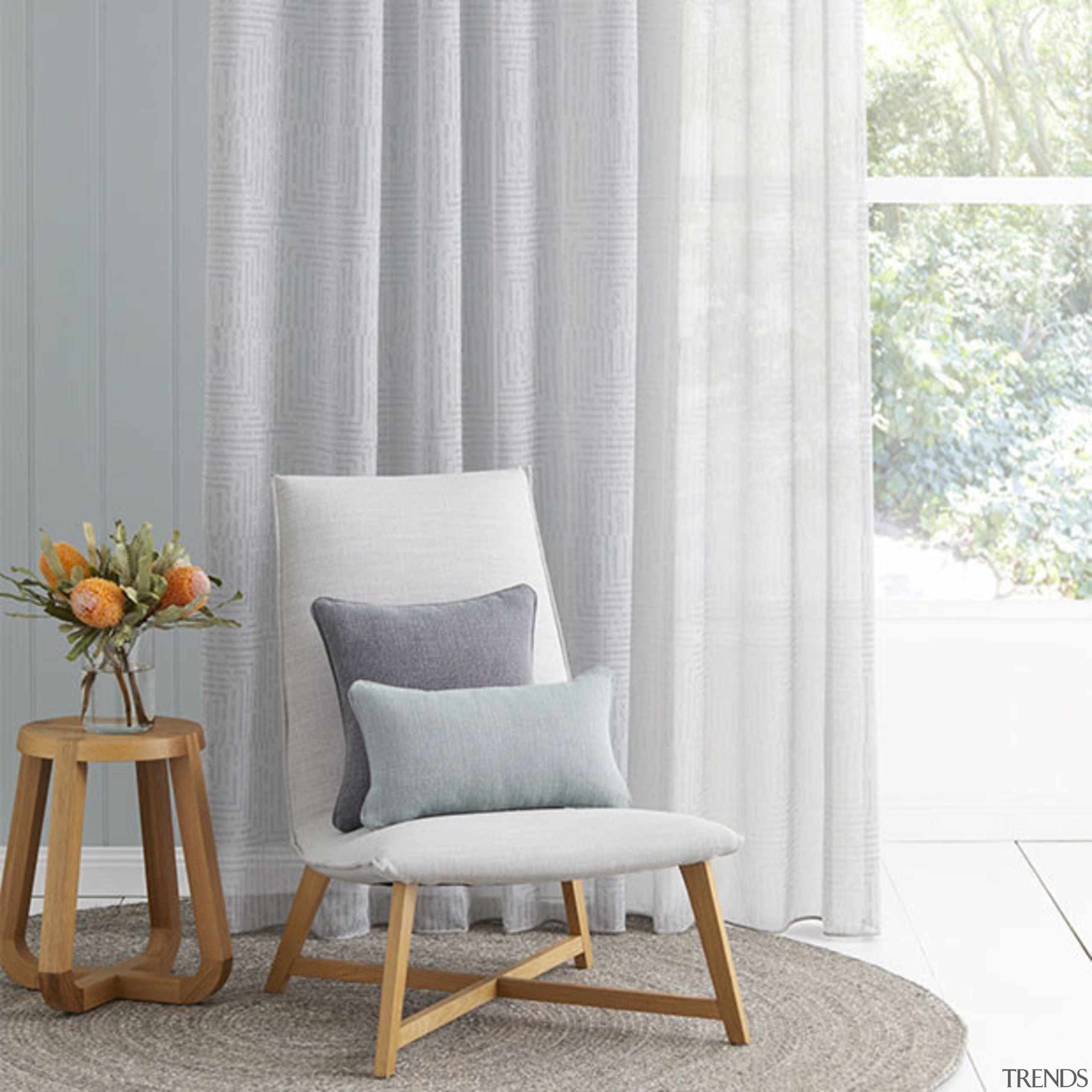 Presenting a sophisticated sheer with a soft lightweight chair, couch, curtain, cushion, floor, furniture, home, interior design, living room, table, textile, window, window covering, window treatment, gray, white