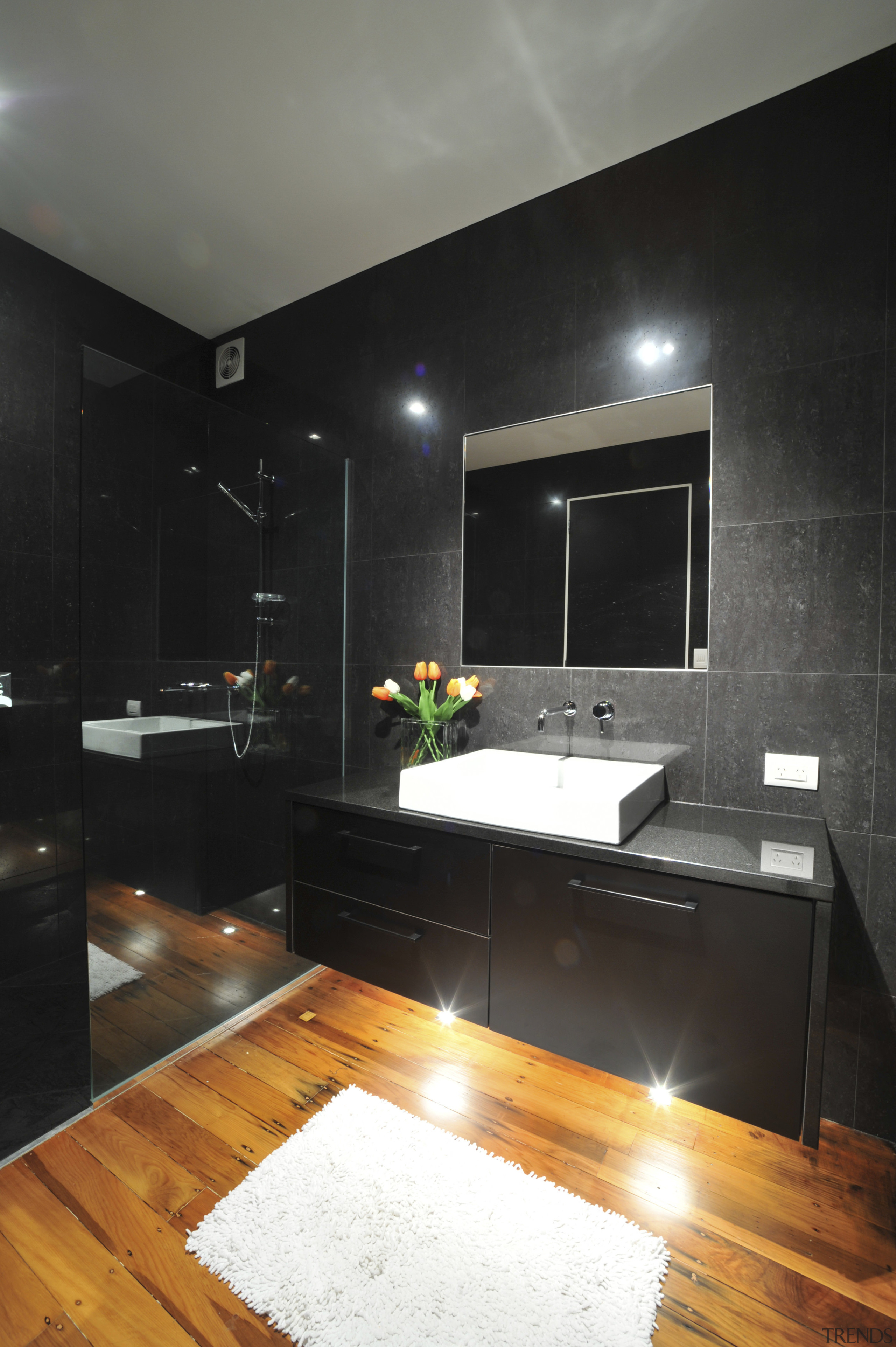 Black panels by The Laminex Group in this bathroom, cabinetry, ceiling, countertop, floor, home, interior design, kitchen, light fixture, lighting, room, wood flooring, black