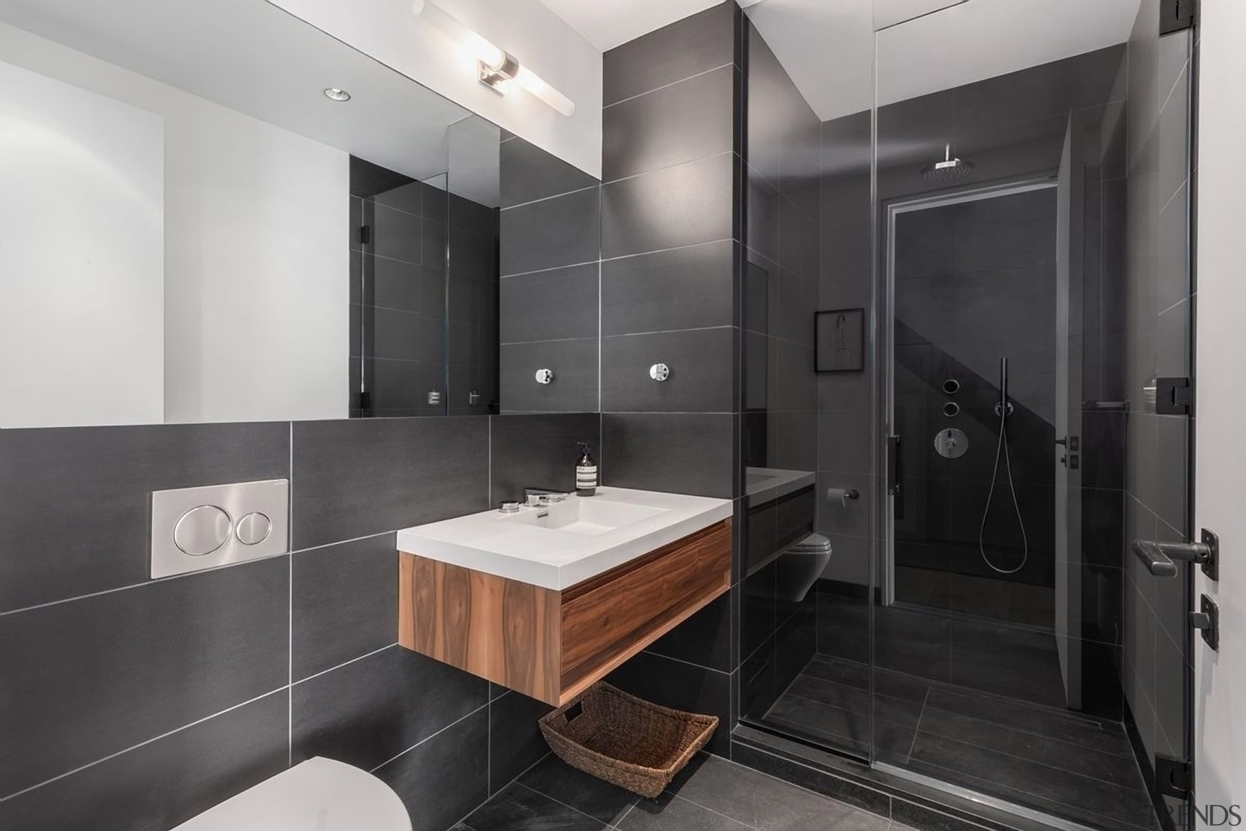 The monotone bathroom with a splash of wood 