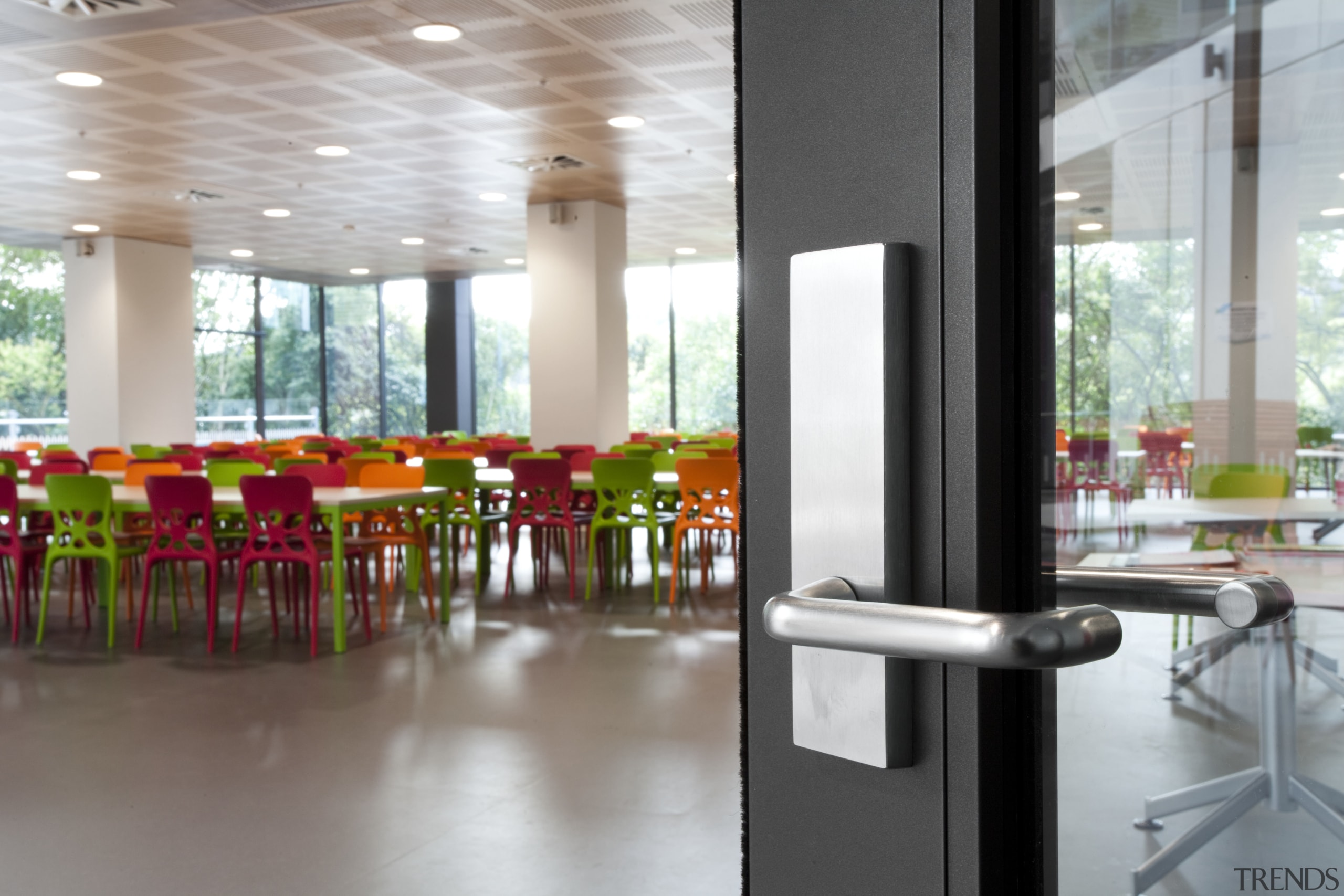 View of door handle with colourful chairs in architecture, interior design, real estate, table, gray