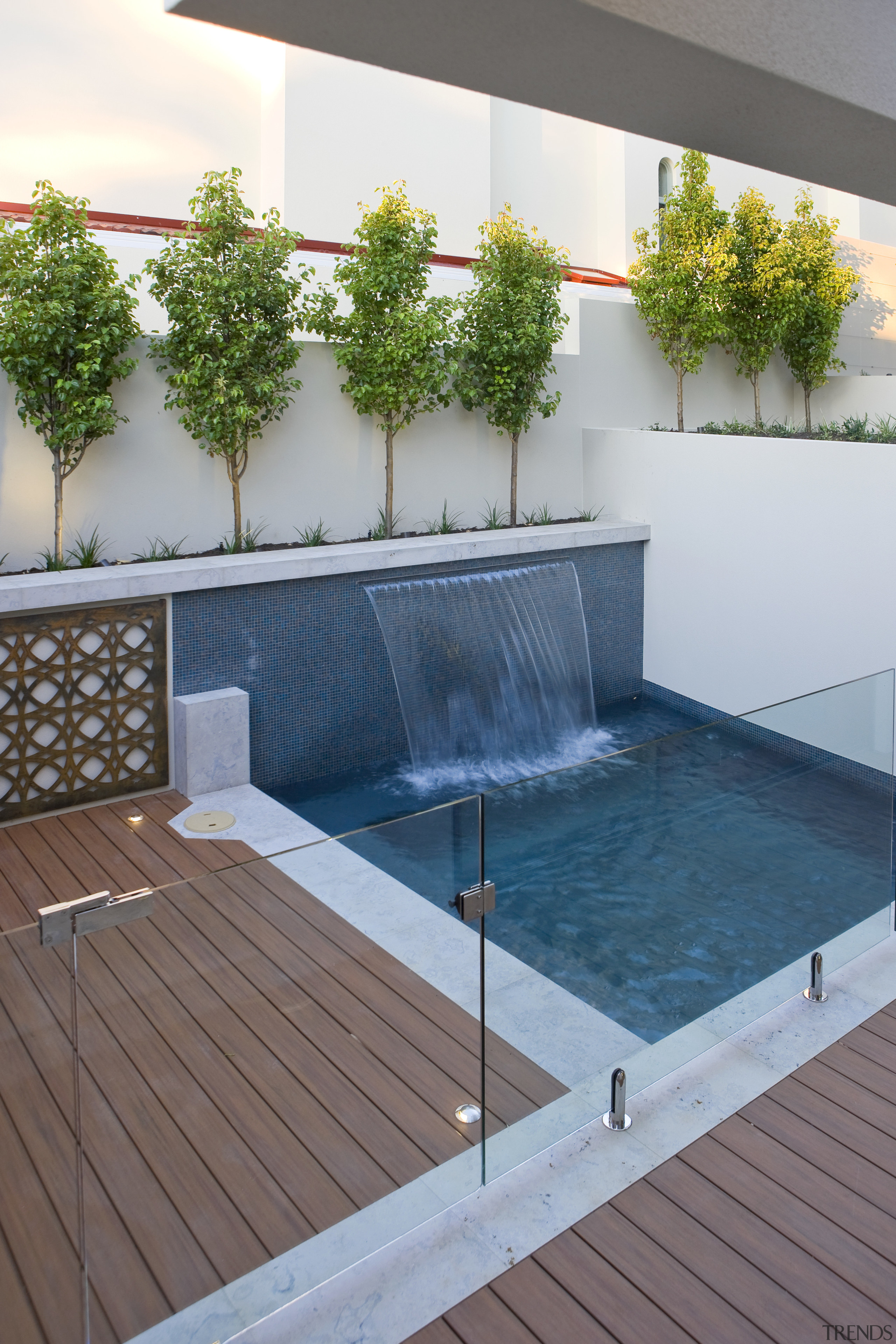 View of pool with water feature and deck leisure, outdoor structure, property, swimming pool, water, gray