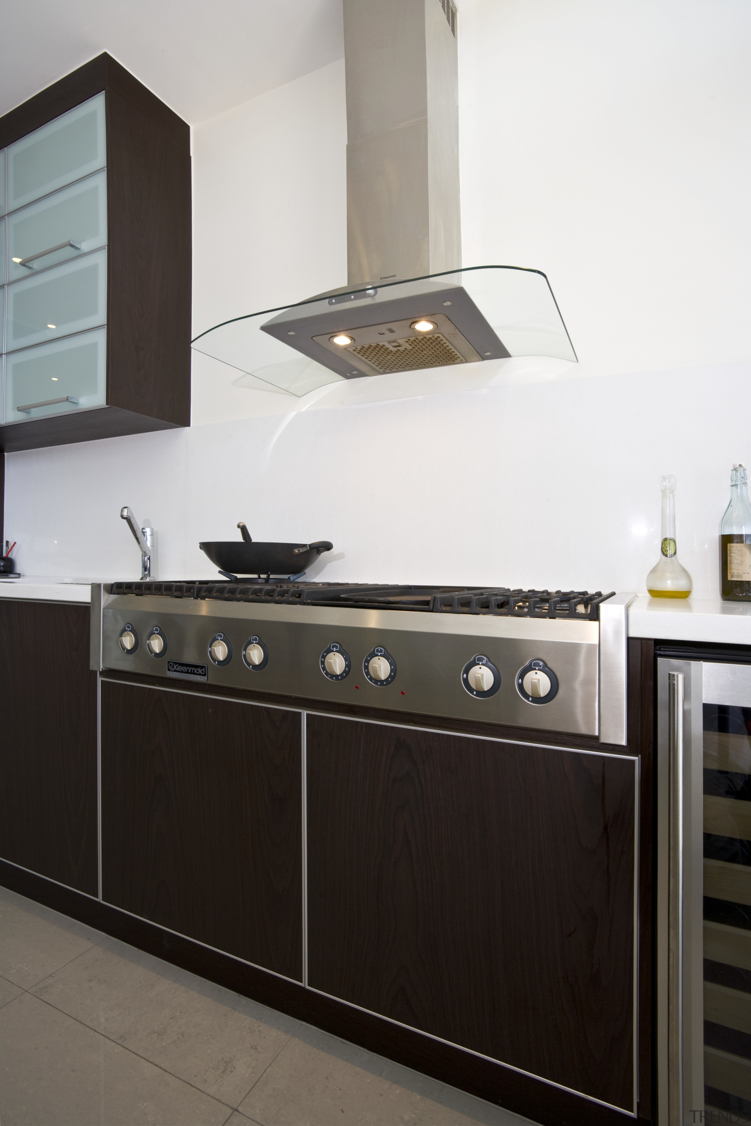 View of cooktop and hood in this custom-designed cabinetry, countertop, cuisine classique, home appliance, interior design, kitchen, kitchen appliance, kitchen stove, white, black