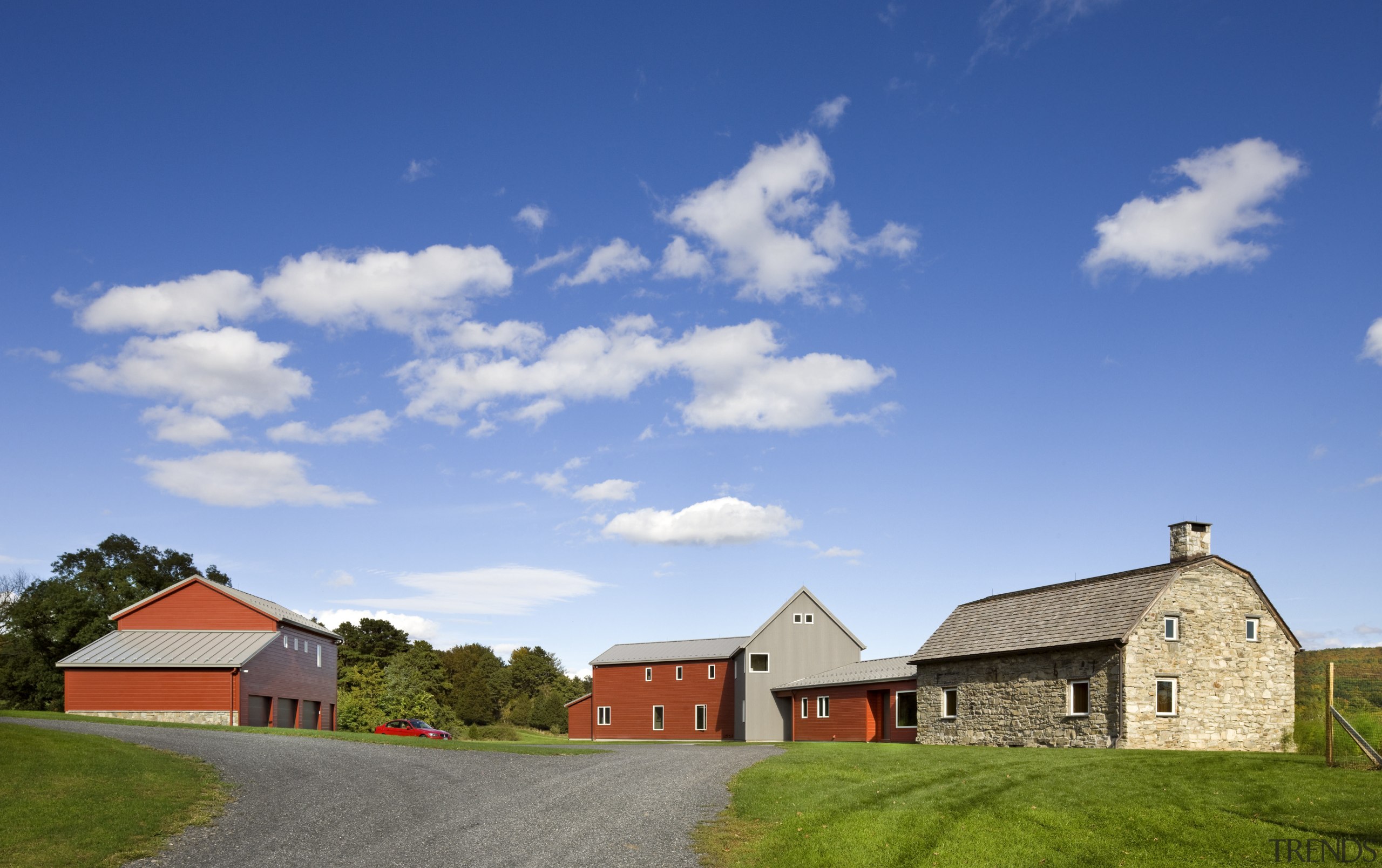 Architect Alexander Gorlin distilled the essence of a barn, cloud, cottage, estate, farm, farmhouse, field, grassland, home, house, land lot, landscape, property, real estate, residential area, rural area, sky, teal