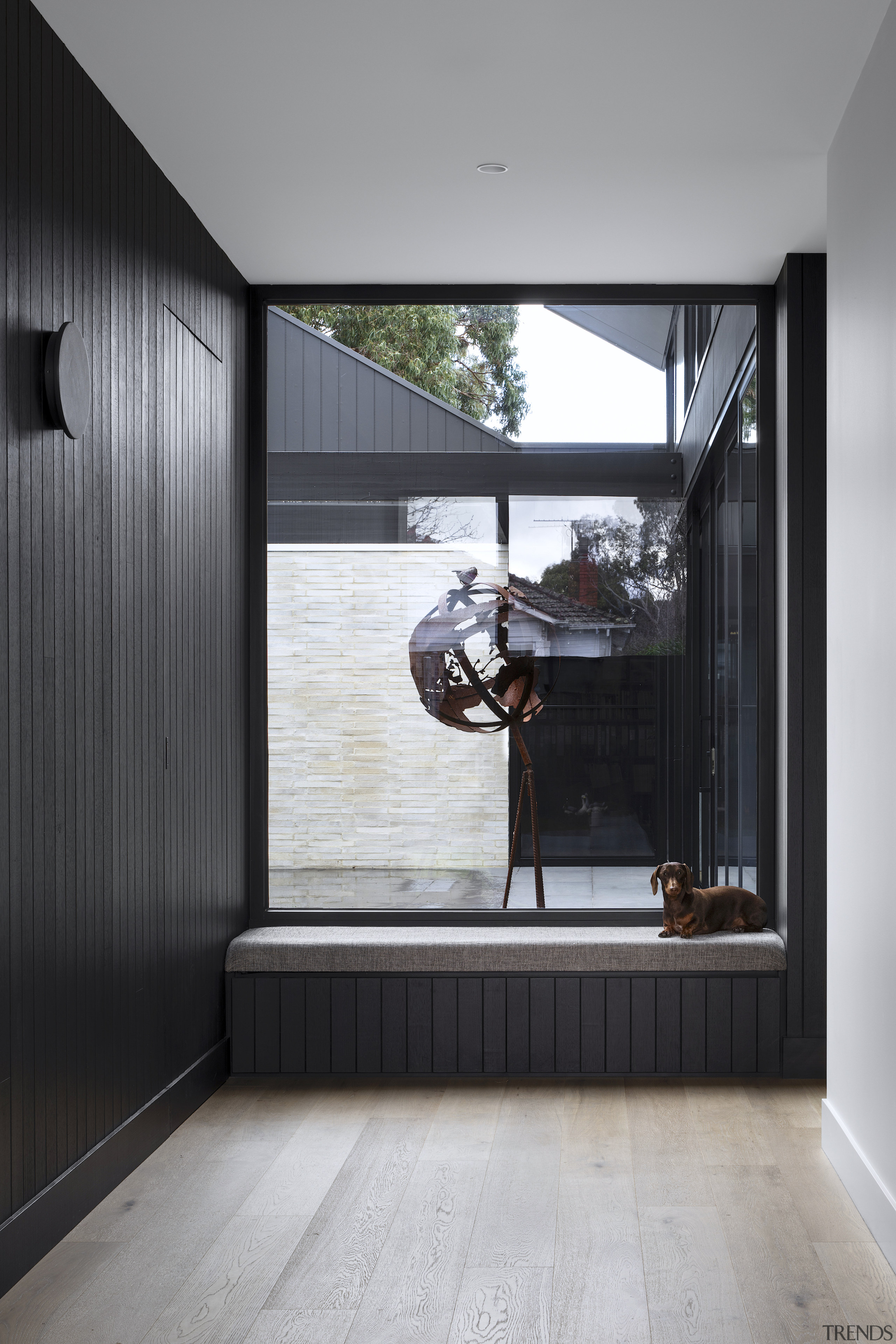 Dog-friendly reading nook at end of entry hall 