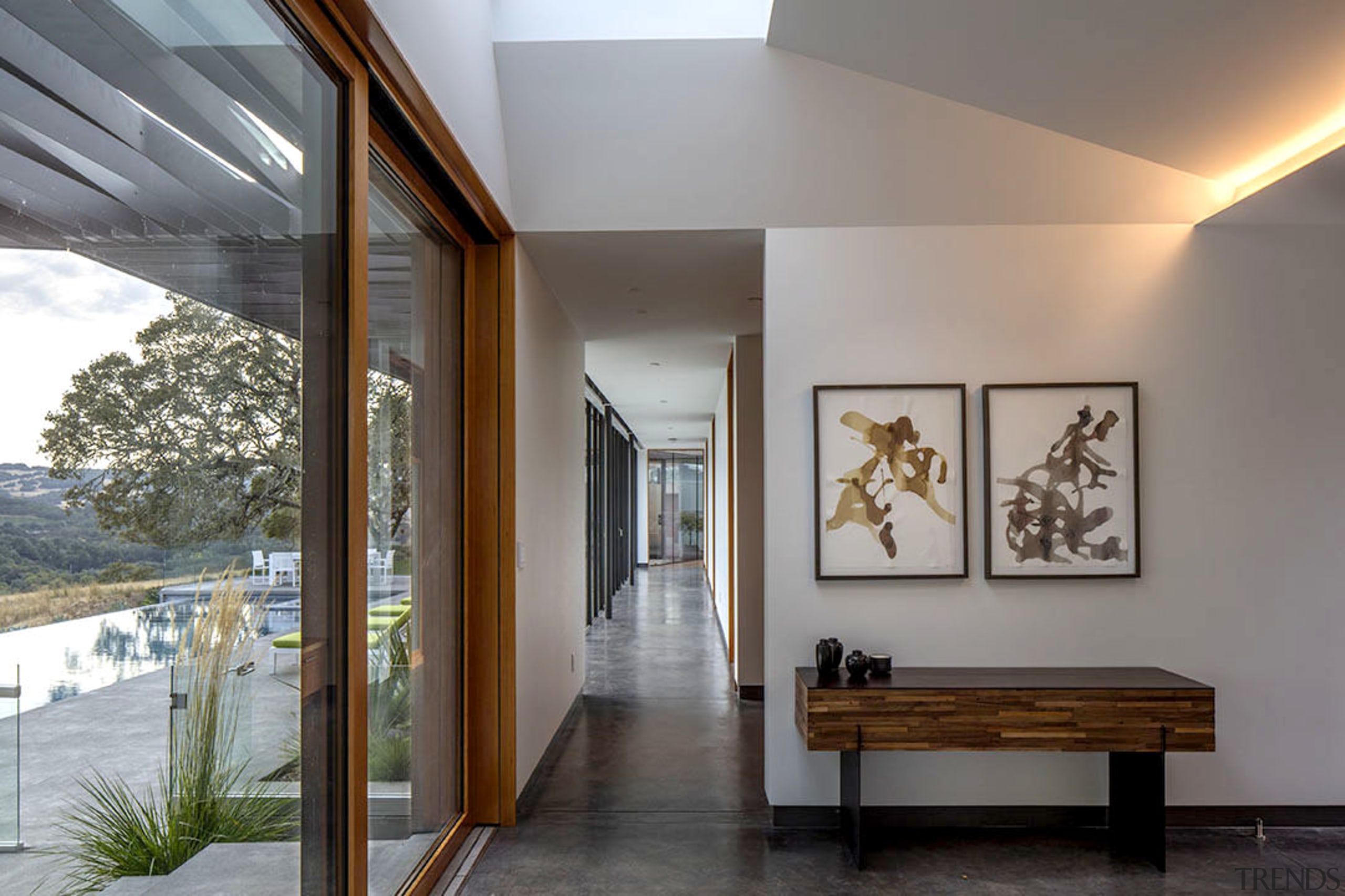 Accessed from the entranceway, the long arm of architecture, ceiling, daylighting, home, house, interior design, gray