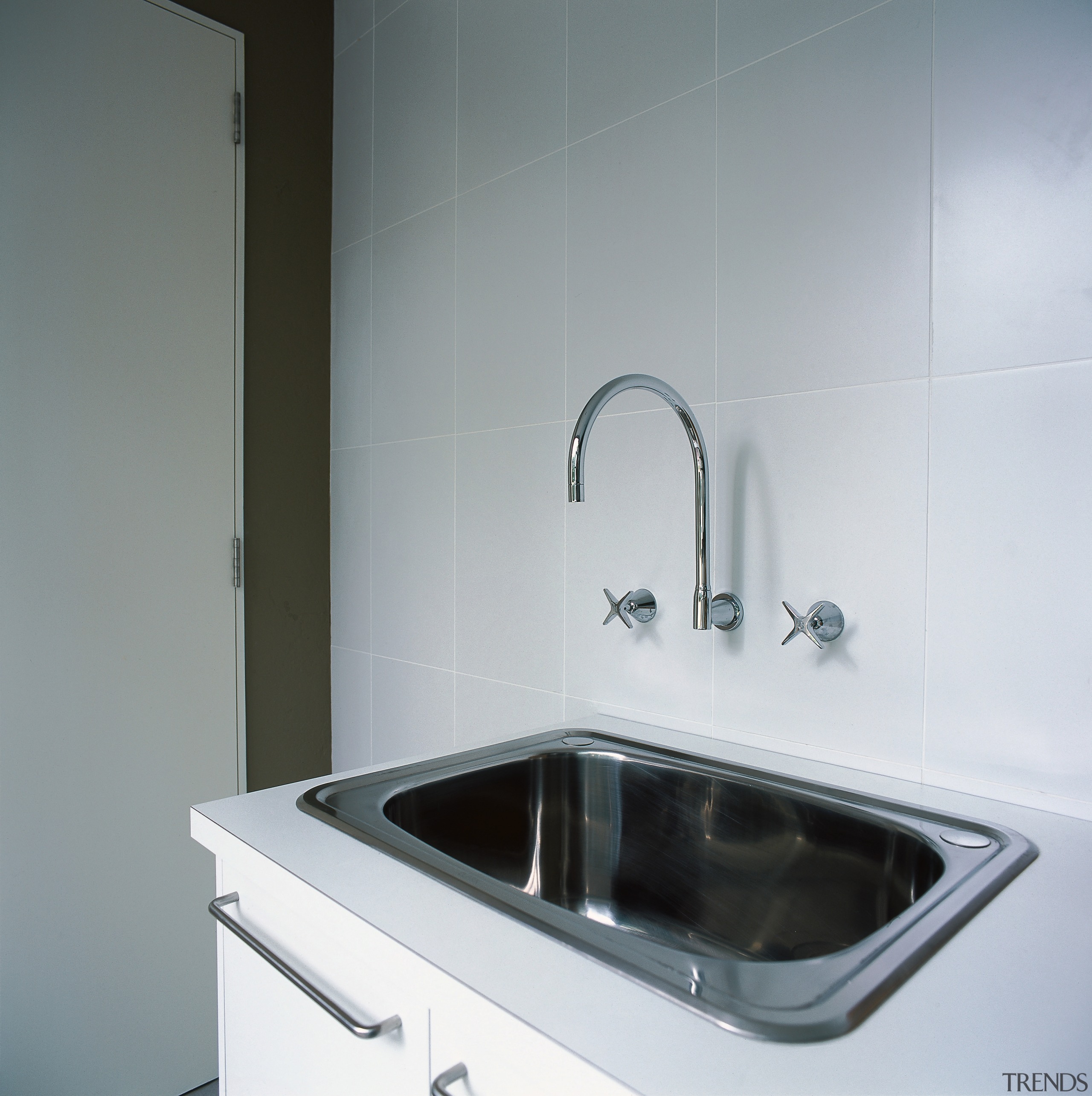 Closeup of laundry tub with wall mounted faucets. bathroom, bathroom sink, countertop, home appliance, kitchen, plumbing fixture, product design, sink, tap, gray