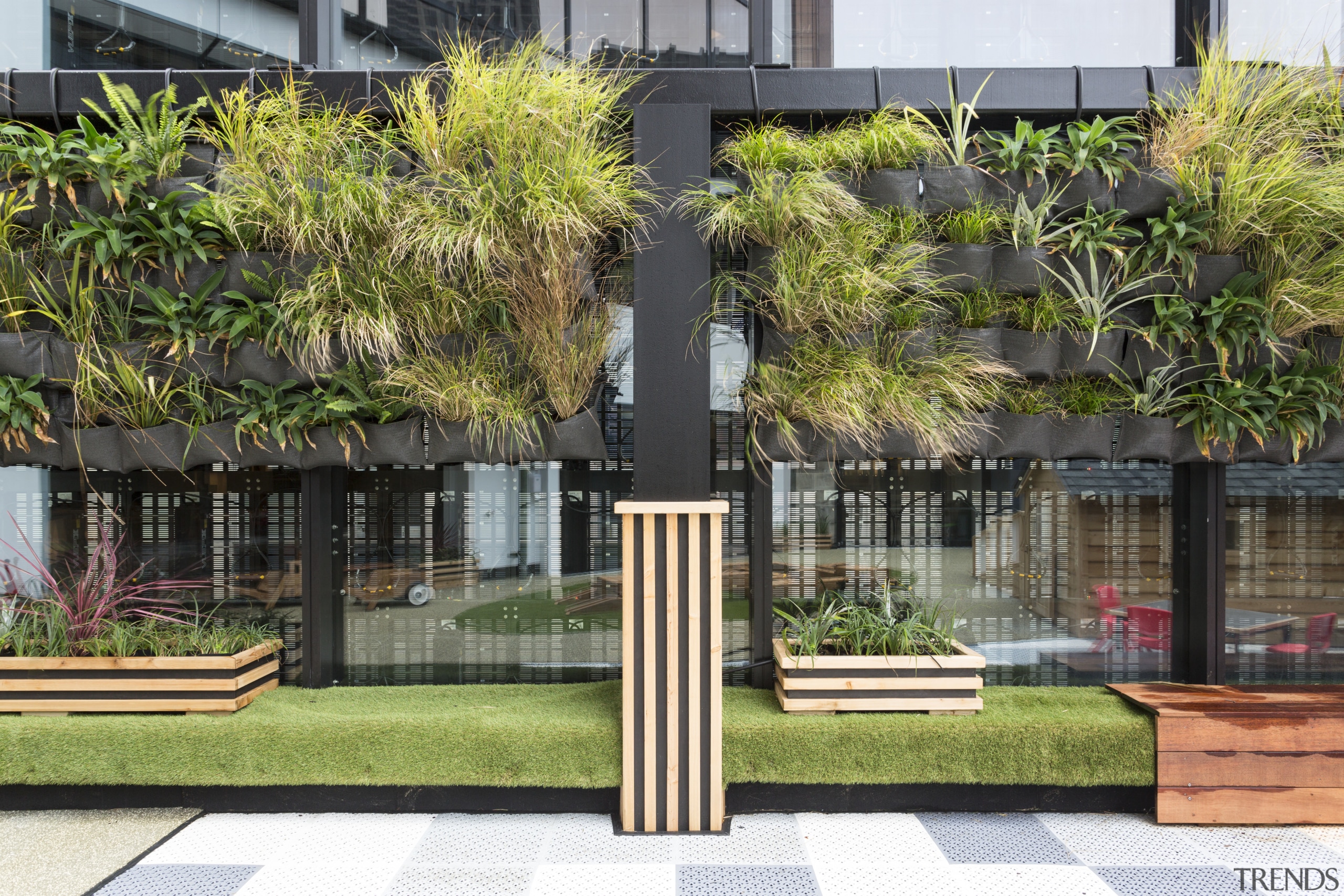 Hanging gardens on the perimeter wall of Cosmokids architecture, arecales, condominium, facade, grass, home, house, neighbourhood, outdoor structure, palm tree, plant, property, real estate, residential area, tree, black