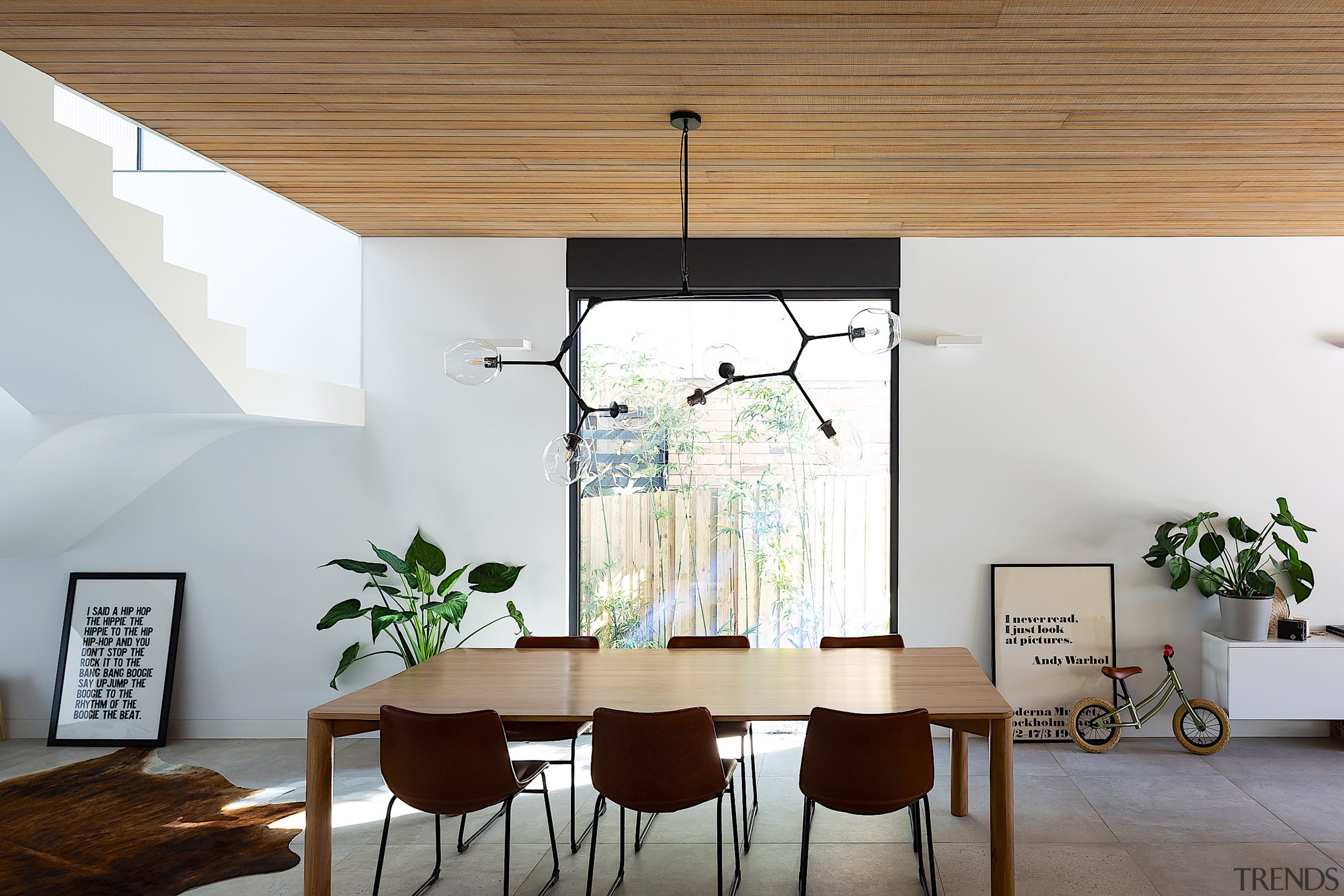 Dining with artistic pendant overhead. - Treading lightly 