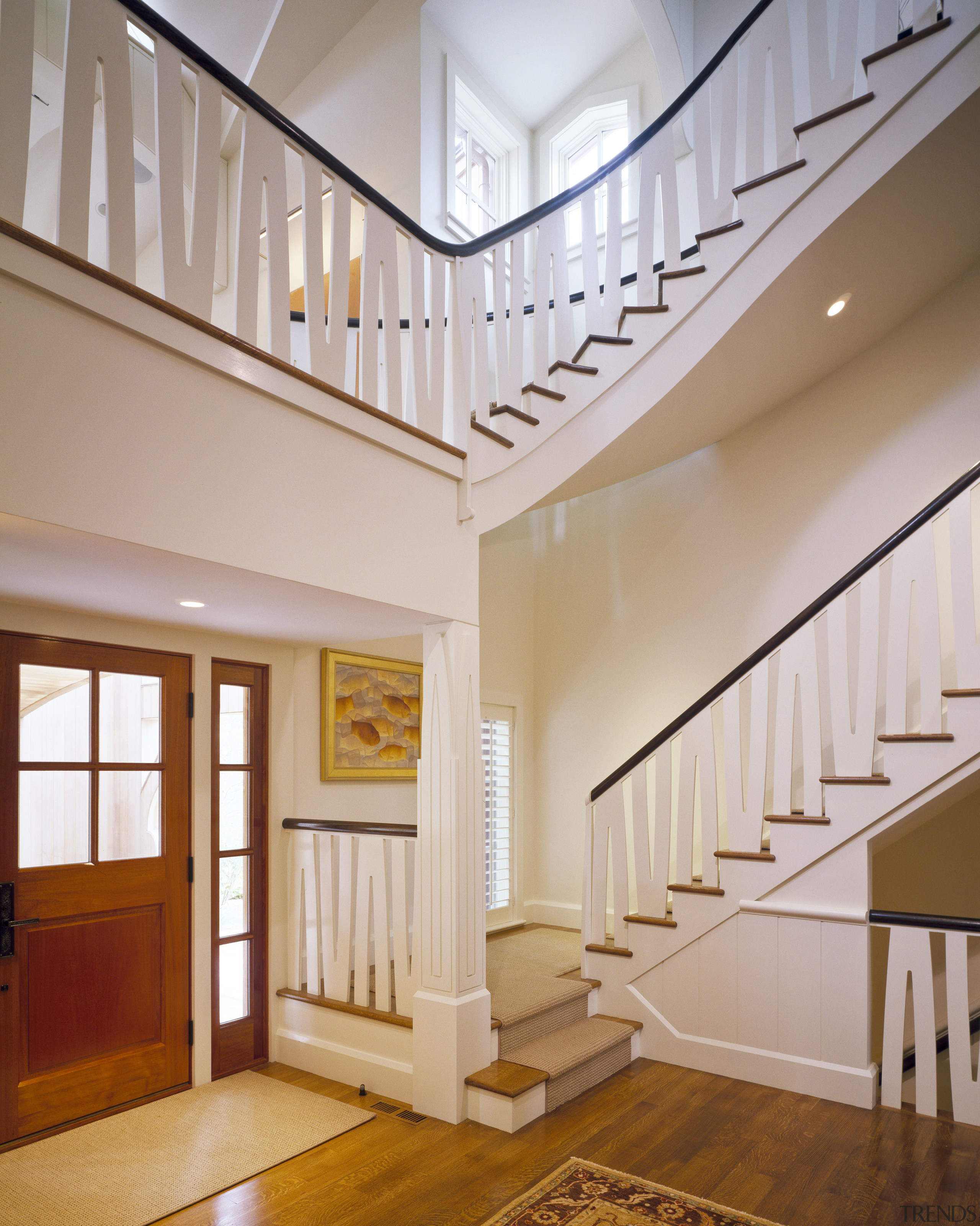 View of staircase with light toned walls and apartment, architecture, baluster, ceiling, daylighting, estate, floor, flooring, hall, handrail, hardwood, home, house, interior design, lobby, molding, real estate, stairs, structure, wall, window, wood, wood flooring, gray