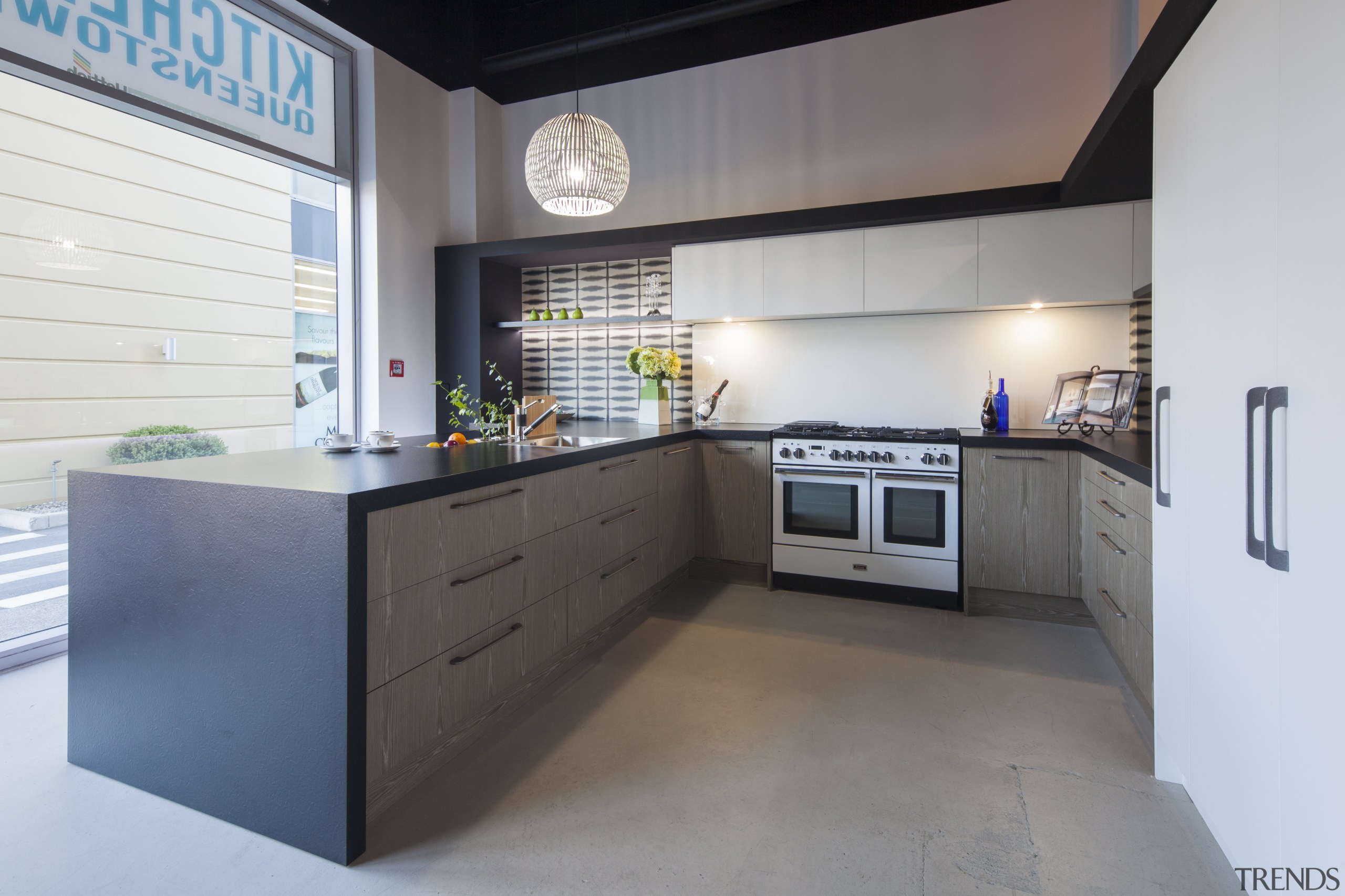 Modern black and white kitchen with grey-toned wood countertop, interior design, kitchen, real estate, gray, white