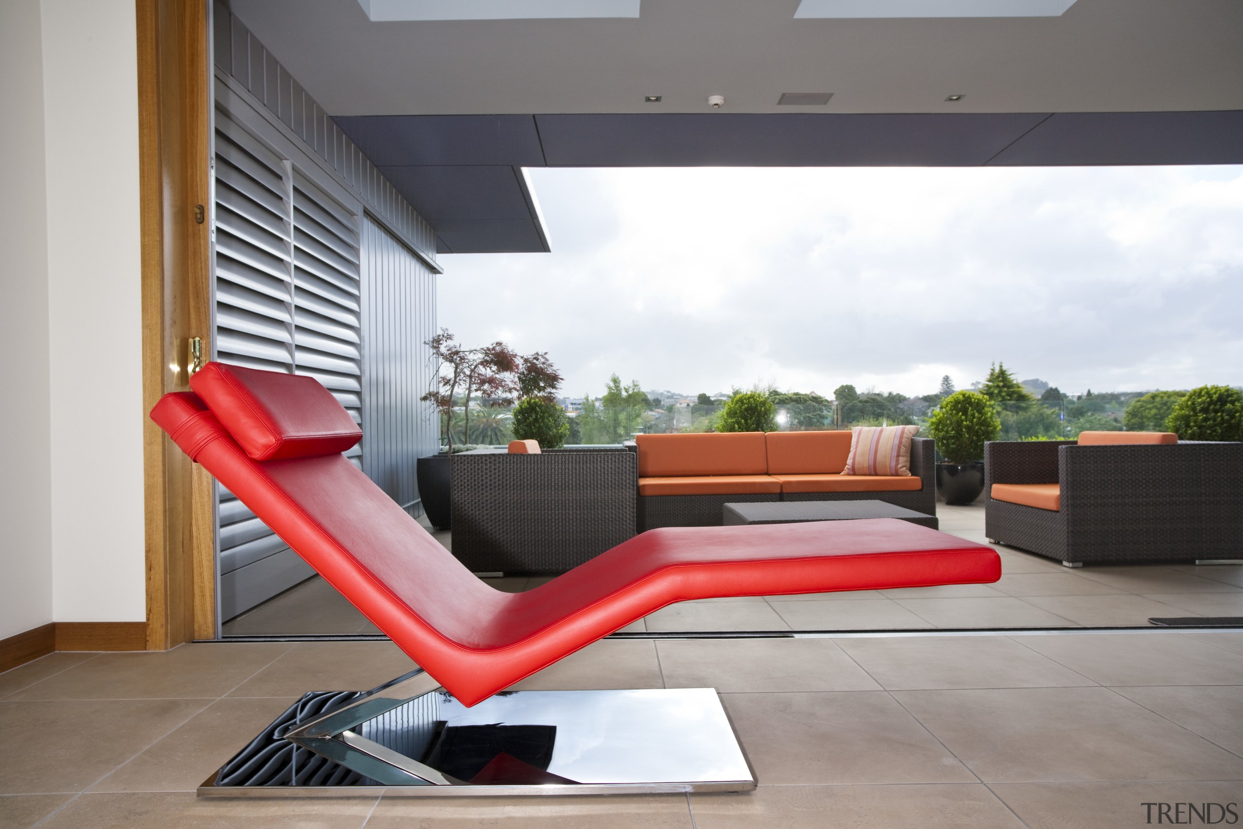 View of living area which features leather lounger chair, chaise longue, couch, furniture, home, house, interior design, living room, outdoor furniture, product design, sunlounger, table, window, gray