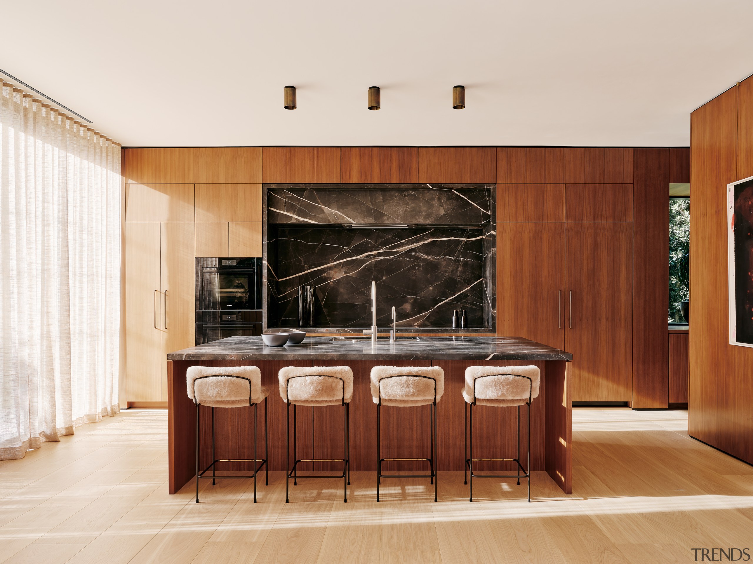 The wood and stone kitchen in its spacious 