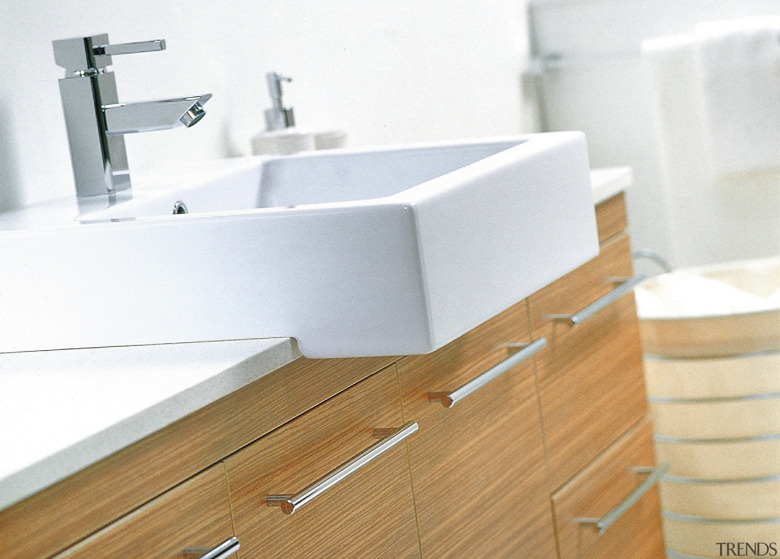 A view of a wooden vanity, white sinks bathroom, bathroom accessory, bathroom cabinet, bathroom sink, floor, plumbing fixture, product, product design, sink, tap, white