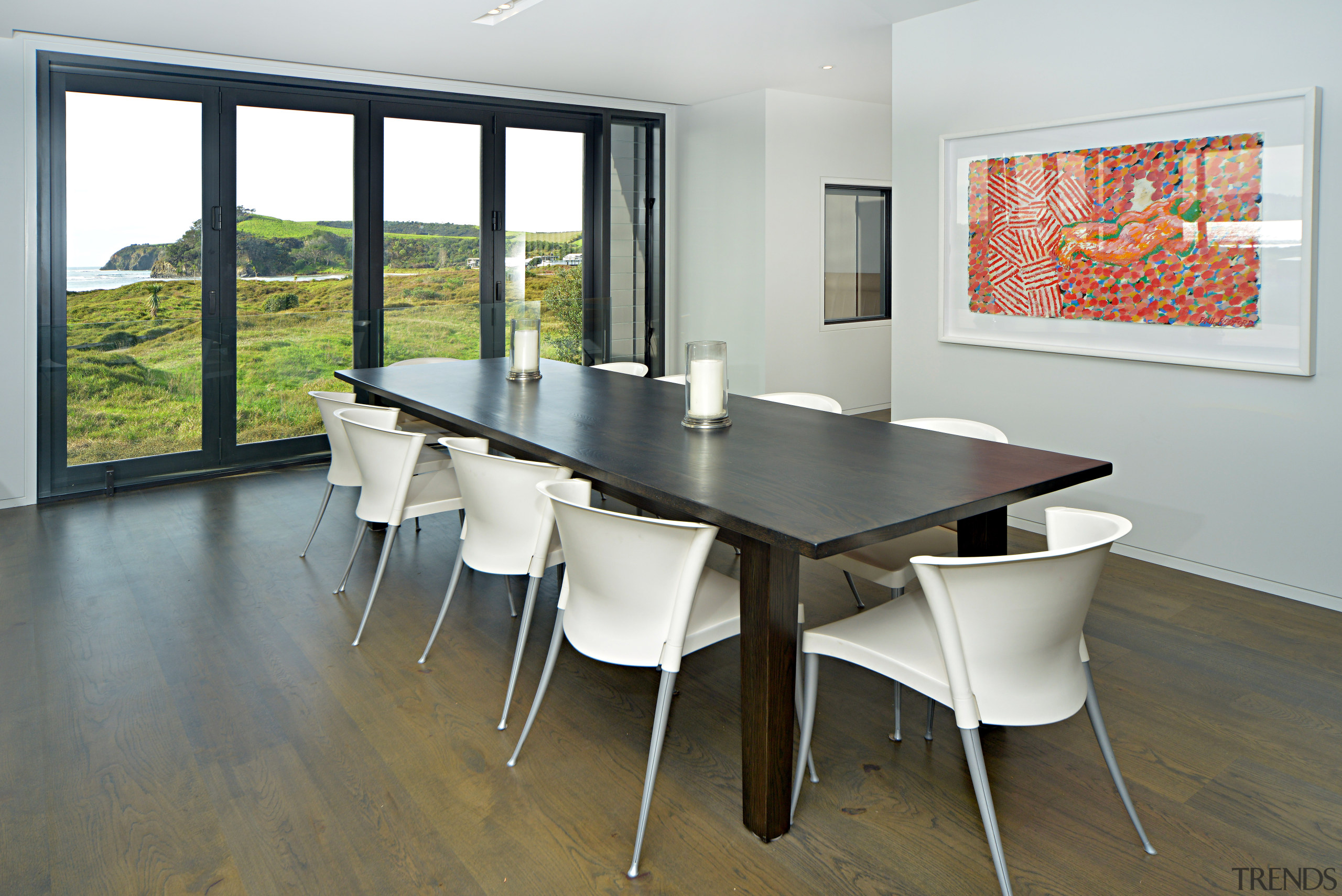 This home has been given a dramatic lift chair, dining room, floor, flooring, furniture, interior design, real estate, room, table, window, gray