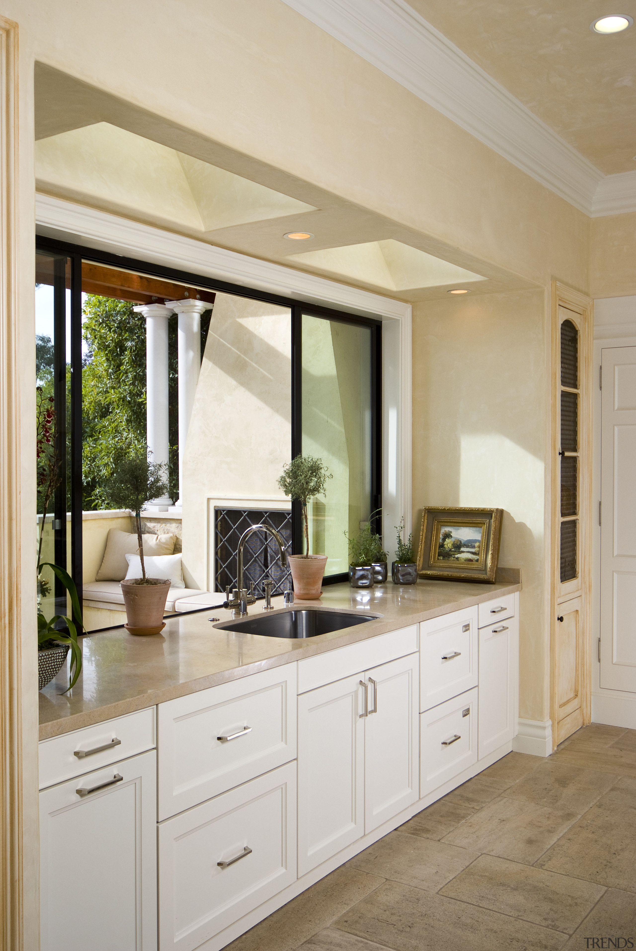 View of kitchen with white cabinetry and black cabinetry, countertop, cuisine classique, floor, home, interior design, kitchen, room, window, gray