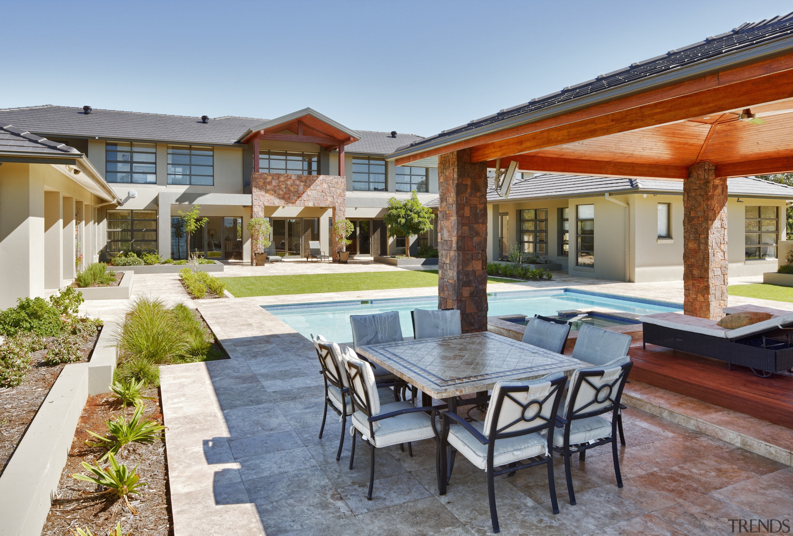 View of contemporary home with outdoor seating area backyard, estate, hacienda, home, house, leisure, patio, property, real estate, resort, swimming pool, villa, gray