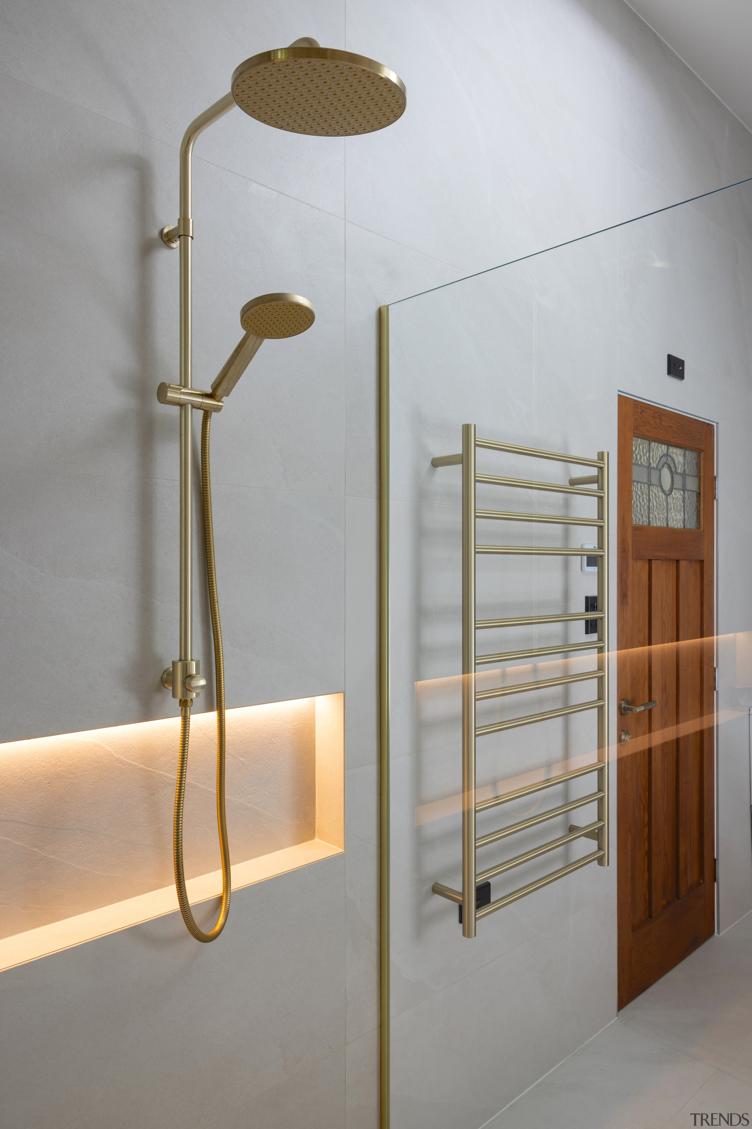 An internally lit shower niche and heated towel 