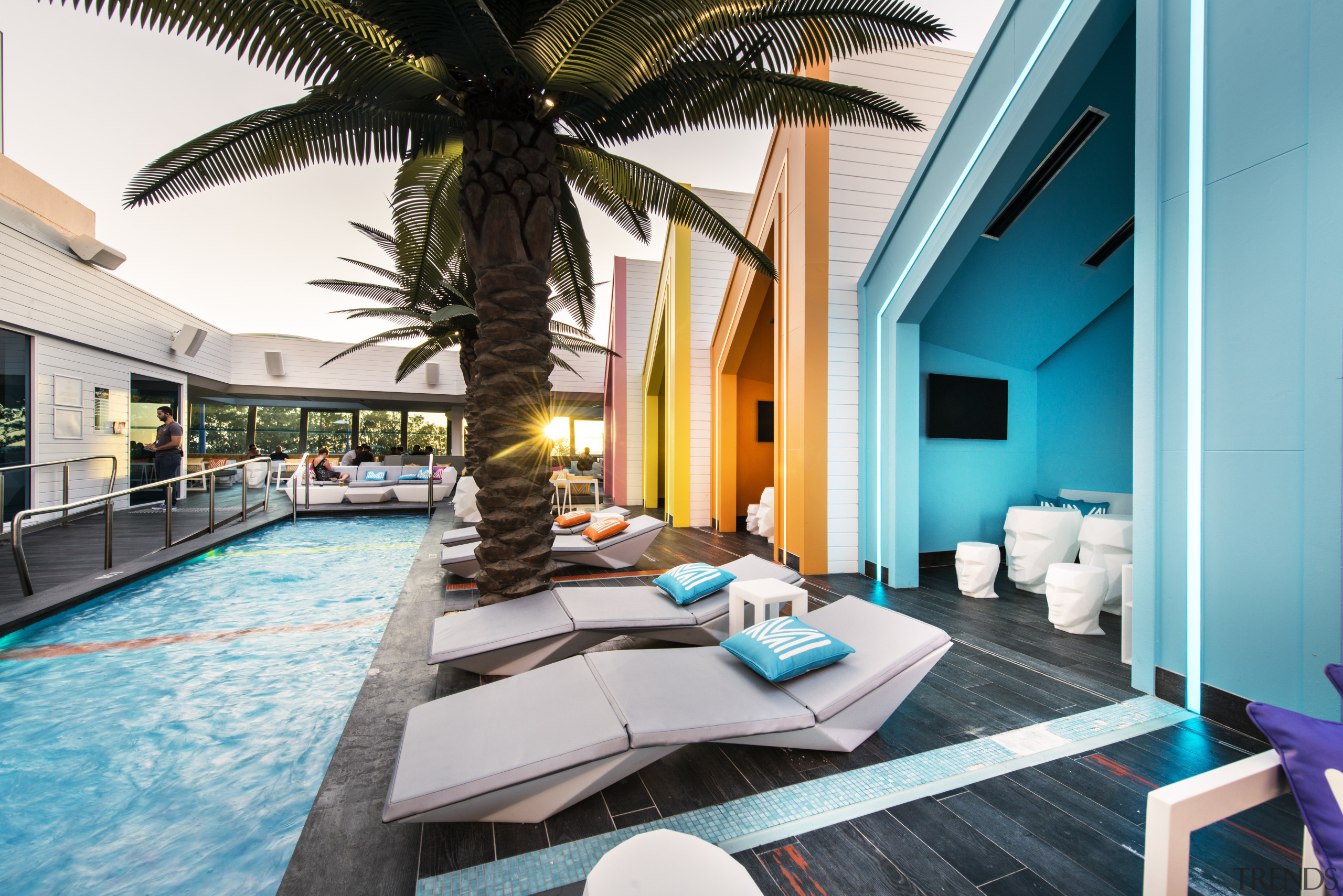 At this beachside venue, a row of cabanas estate, home, hotel, interior design, leisure, property, real estate, resort, swimming pool, vacation, villa, teal, white