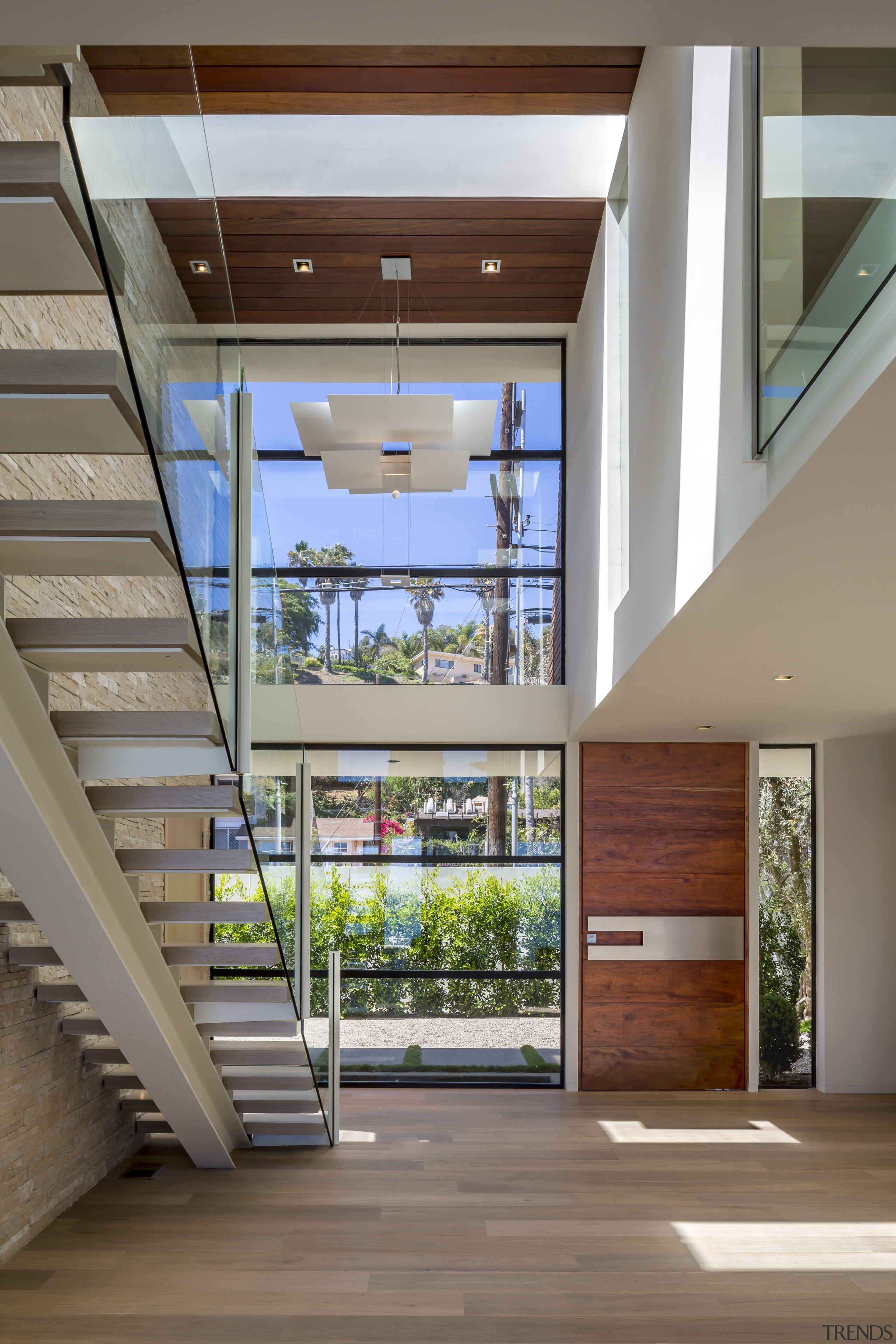 While the main aspect of this home is apartment, architecture, ceiling, condominium, daylighting, estate, home, house, interior design, lobby, real estate, stairs, window, gray, brown