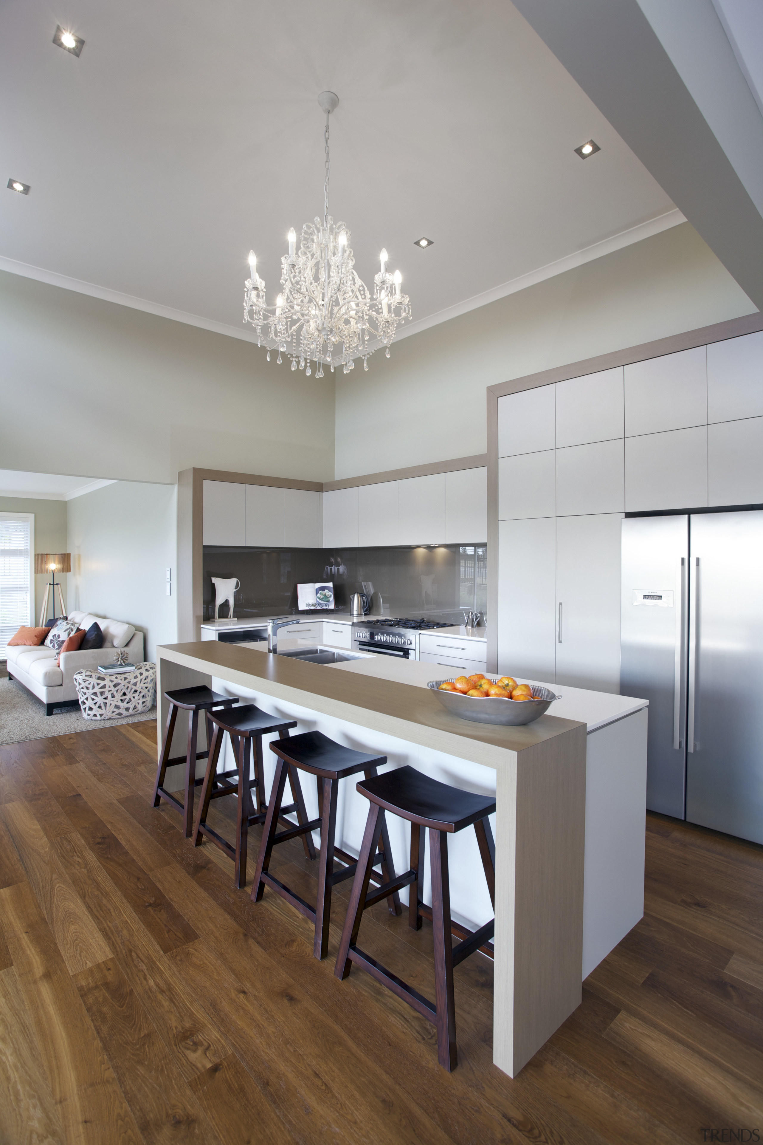 this airy residence is by Fowler Homes - ceiling, countertop, dining room, floor, flooring, hardwood, interior design, kitchen, room, table, wood flooring, gray, brown