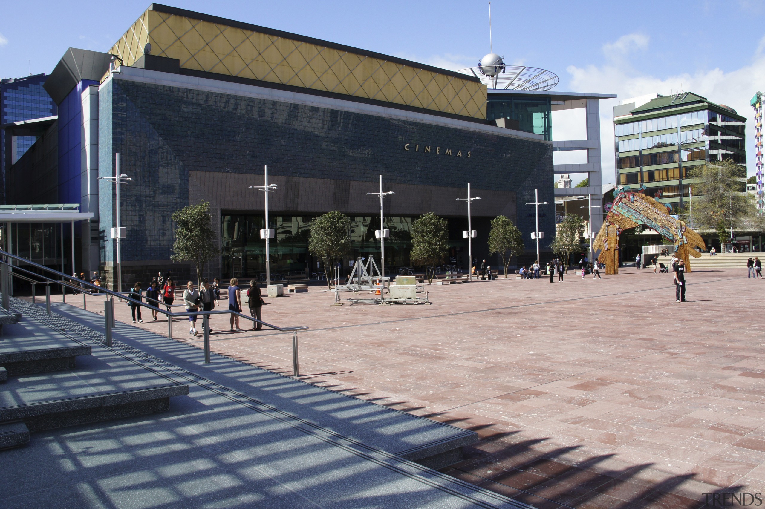 View of Aotea Square which features paving, planters, architecture, building, campus, city, downtown, metropolitan area, mixed use, neighbourhood, plaza, public space, structure, town square, urban design, black, gray