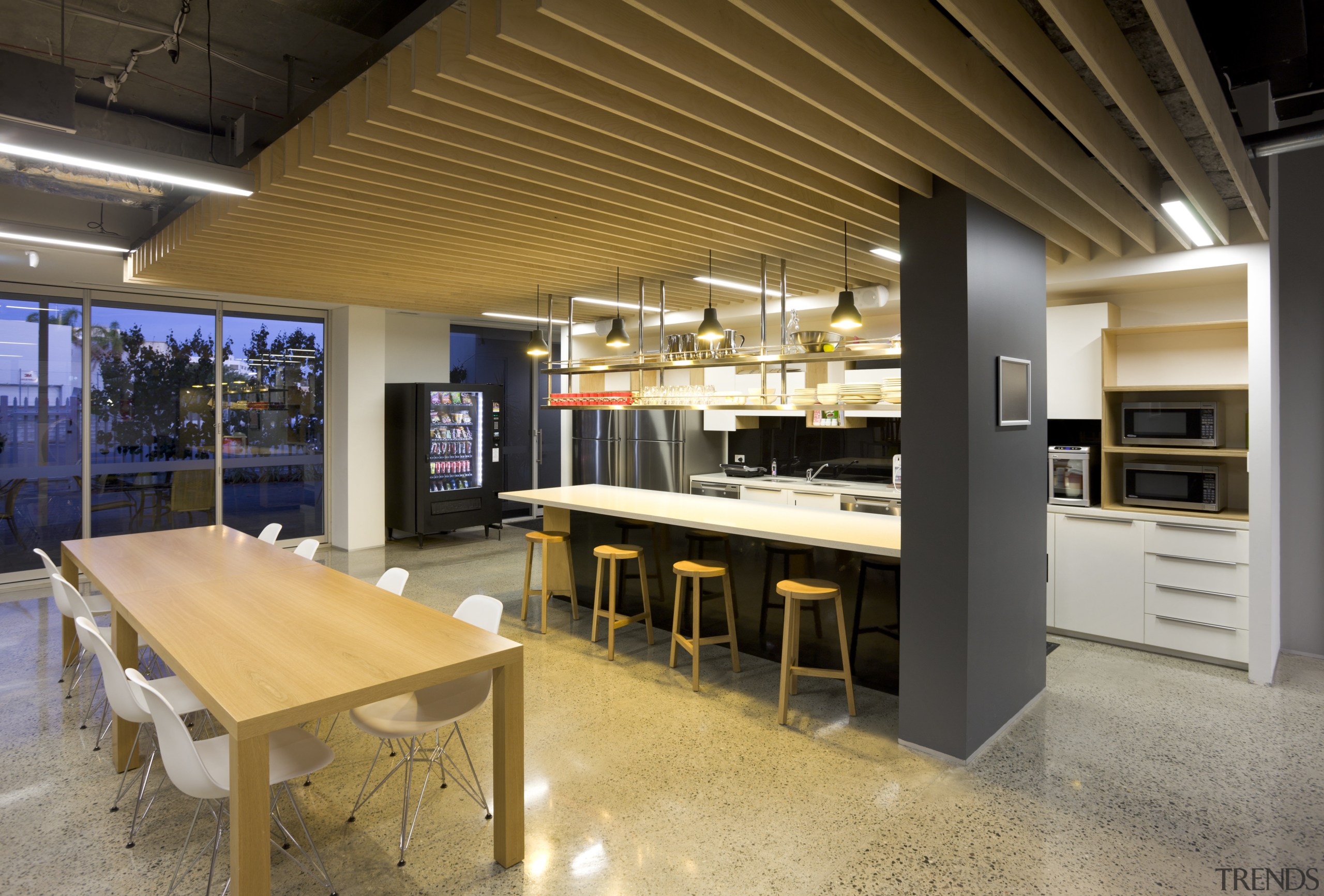 View of kitchen area with wooden tables and interior design, brown