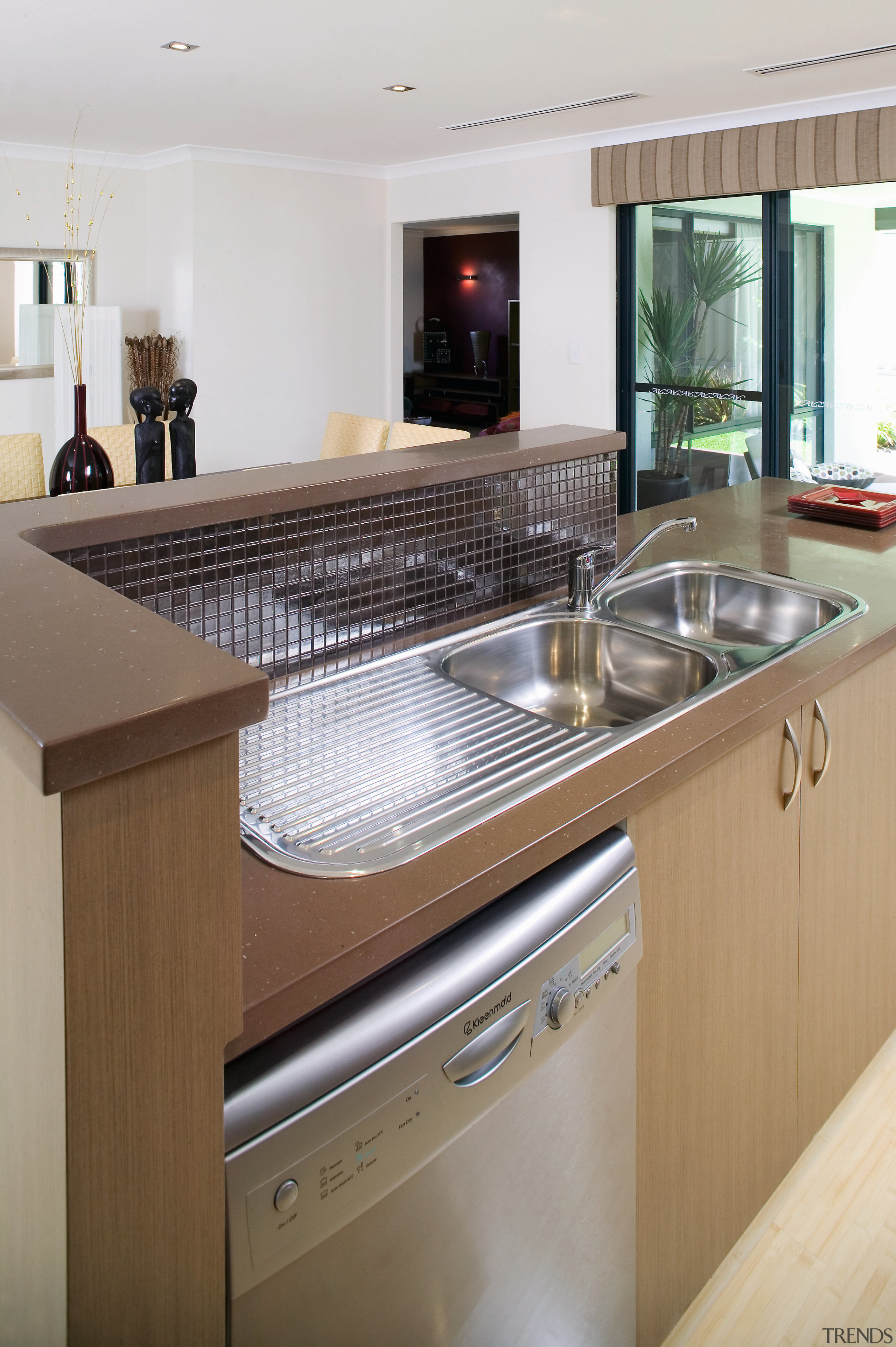 View of kitchen with timber cabinetry, stainless steel cabinetry, countertop, home appliance, kitchen, major appliance, gray, brown