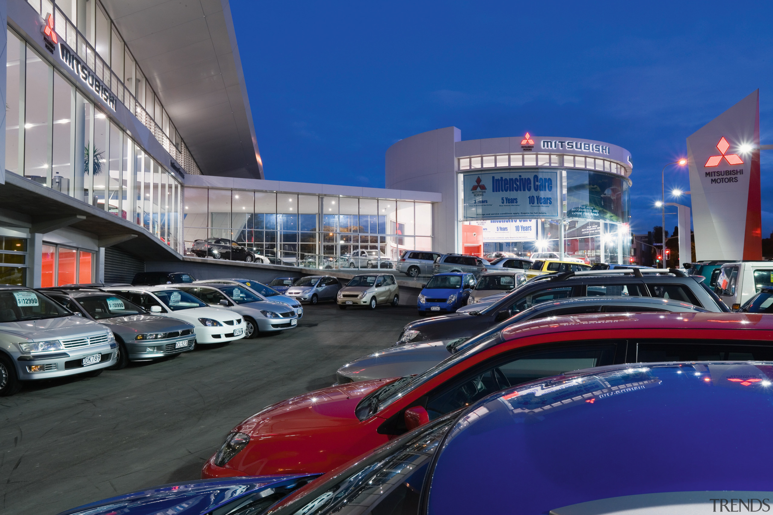 A view of the Mitsubishi Motors building. - automotive design, building, car, city, city car, luxury vehicle, metropolis, metropolitan area, mid size car, blue, black