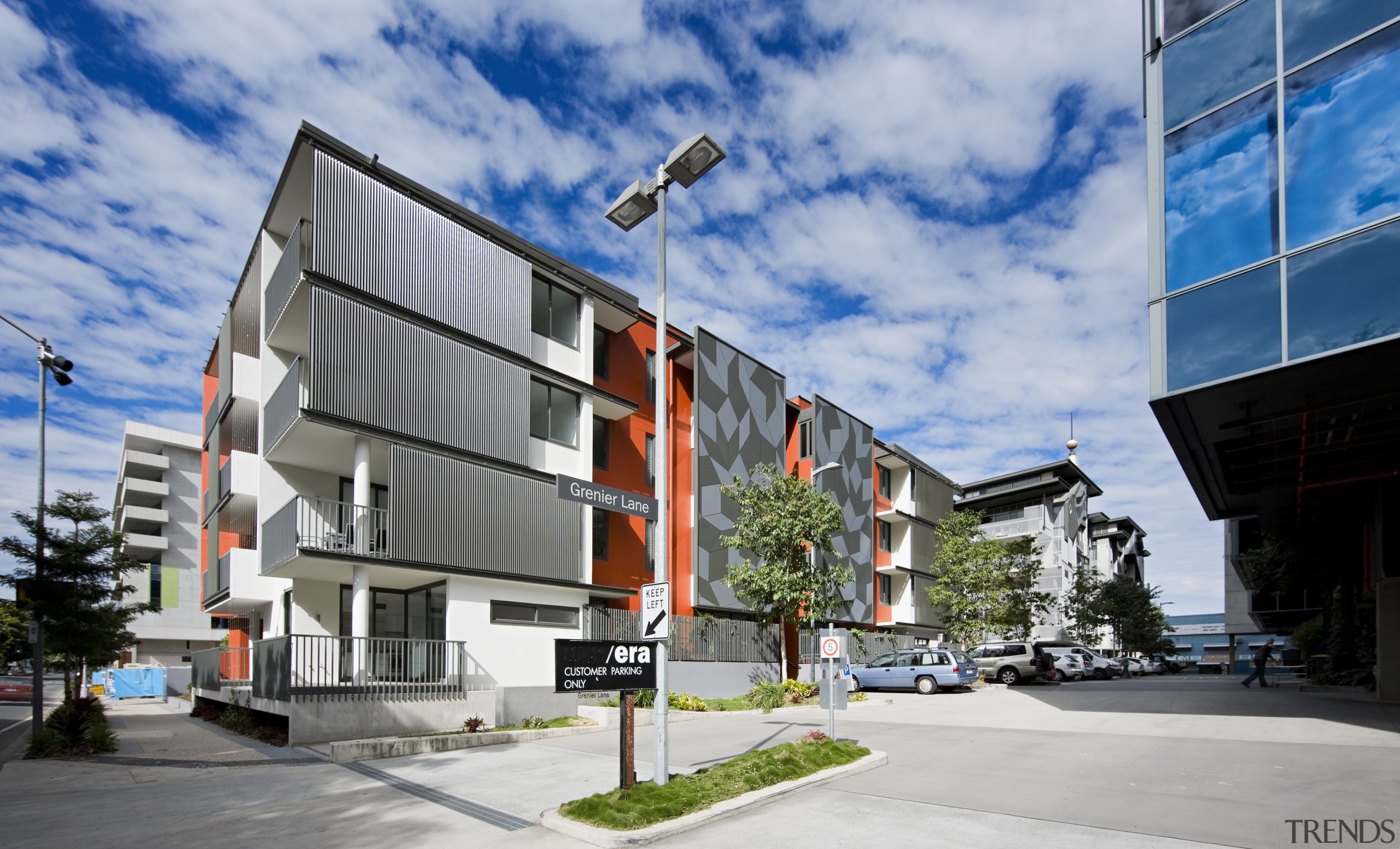 exterior view of the SW1 development which when apartment, architecture, building, commercial building, condominium, corporate headquarters, facade, home, house, metropolitan area, mixed use, neighbourhood, property, real estate, residential area, sky, teal