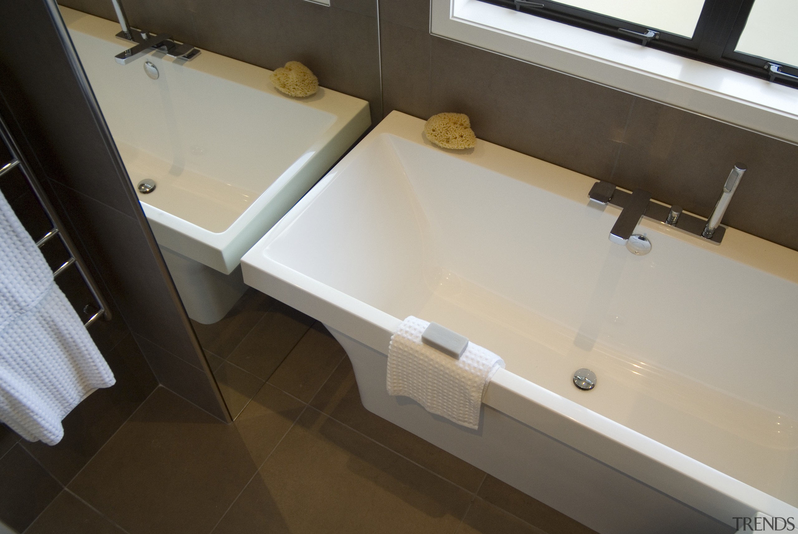 A view of some bathroomware from Robertson Agencies. bathroom, bathtub, floor, flooring, plumbing fixture, property, room, sink, gray, brown