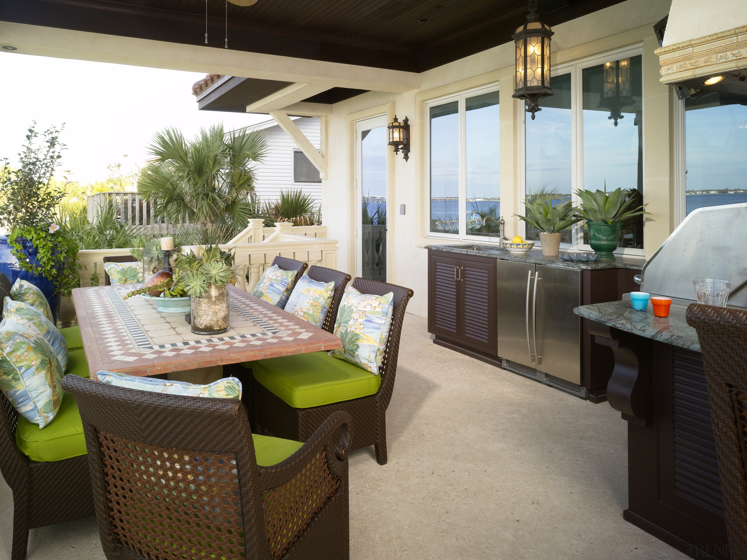 View of an outdoor kitchen at a seaside backyard, estate, home, outdoor structure, patio, porch, property, real estate, white